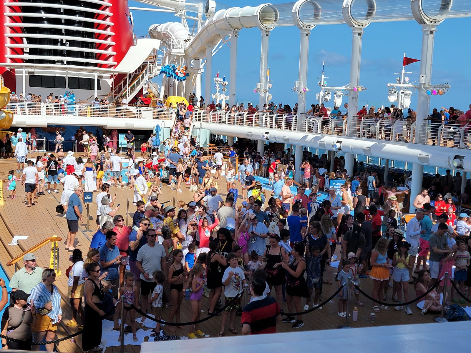 Crowds packed in on deck for sail-away