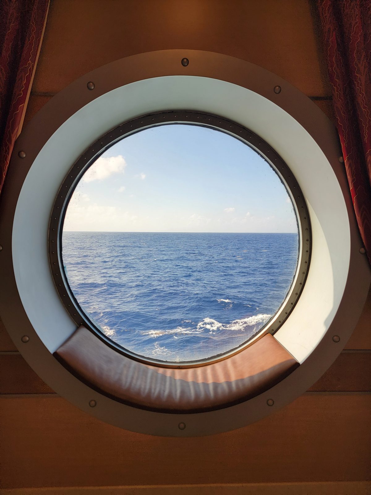A gorgeous day at sea through the porthole