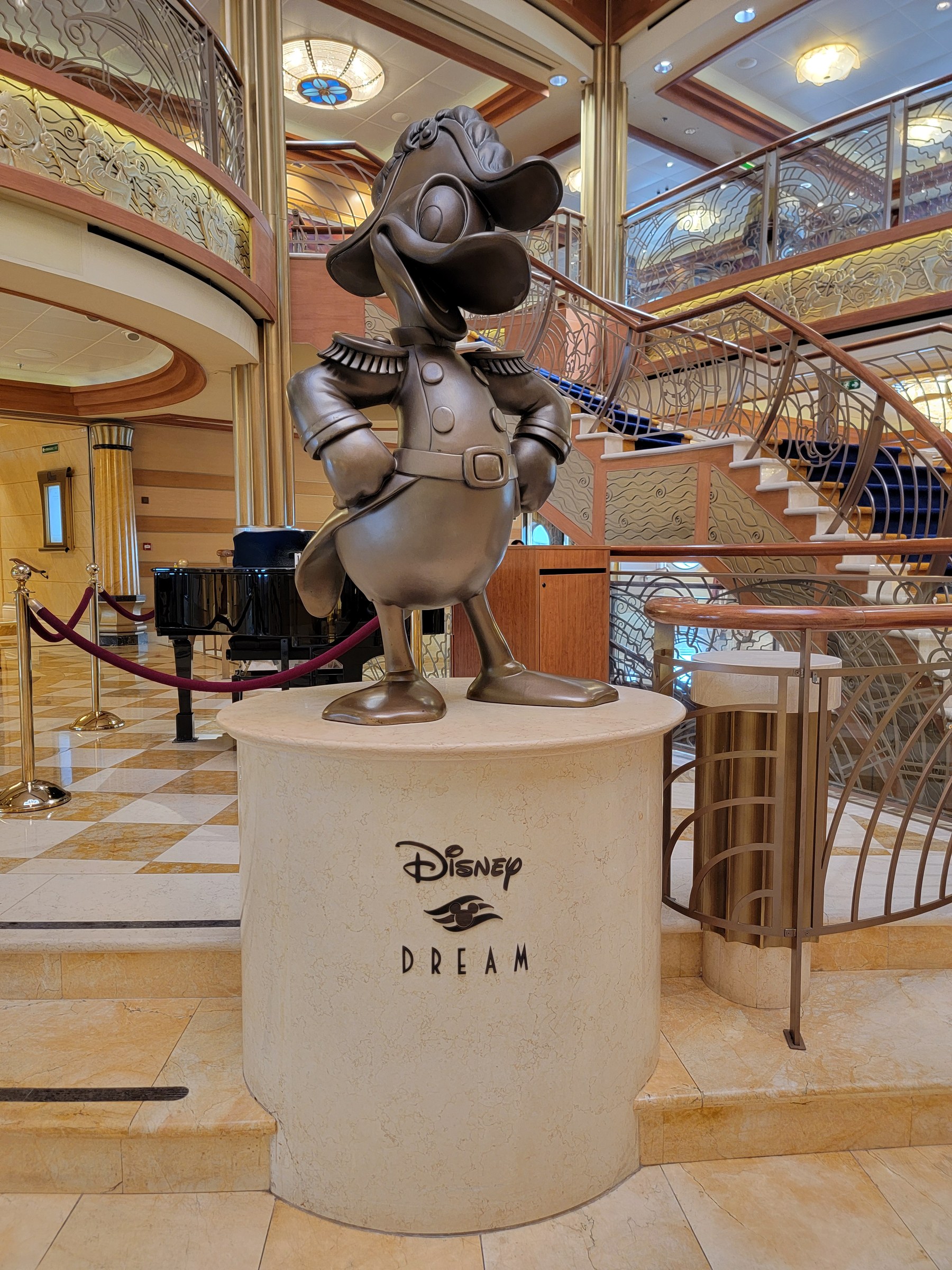 The bronze Donald in the atrium of the Disney Dream