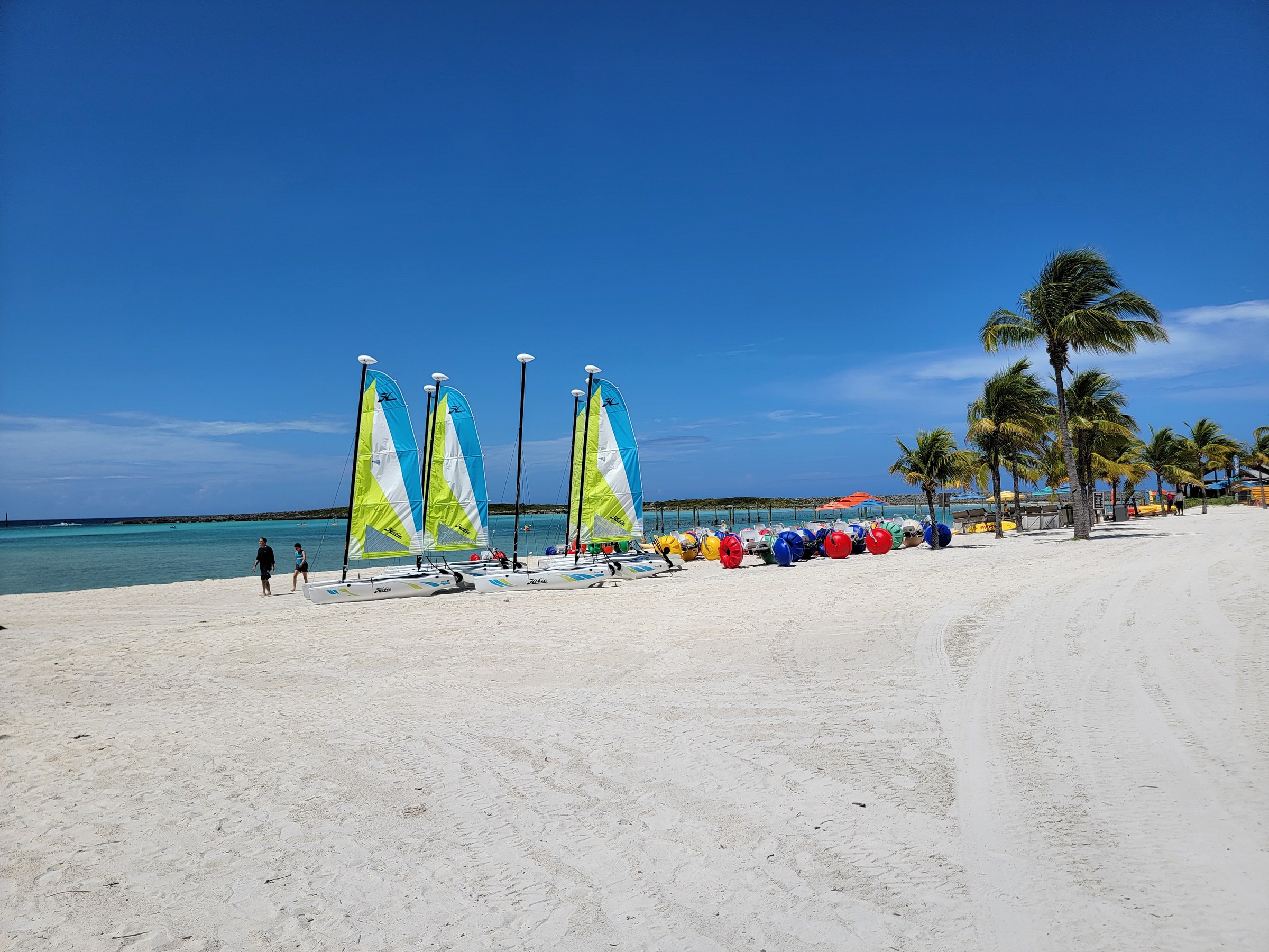 Sailboats lined up on the beach at Castaway Cay