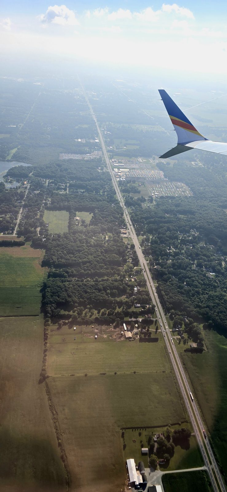 Farmland below the wing at takeoff