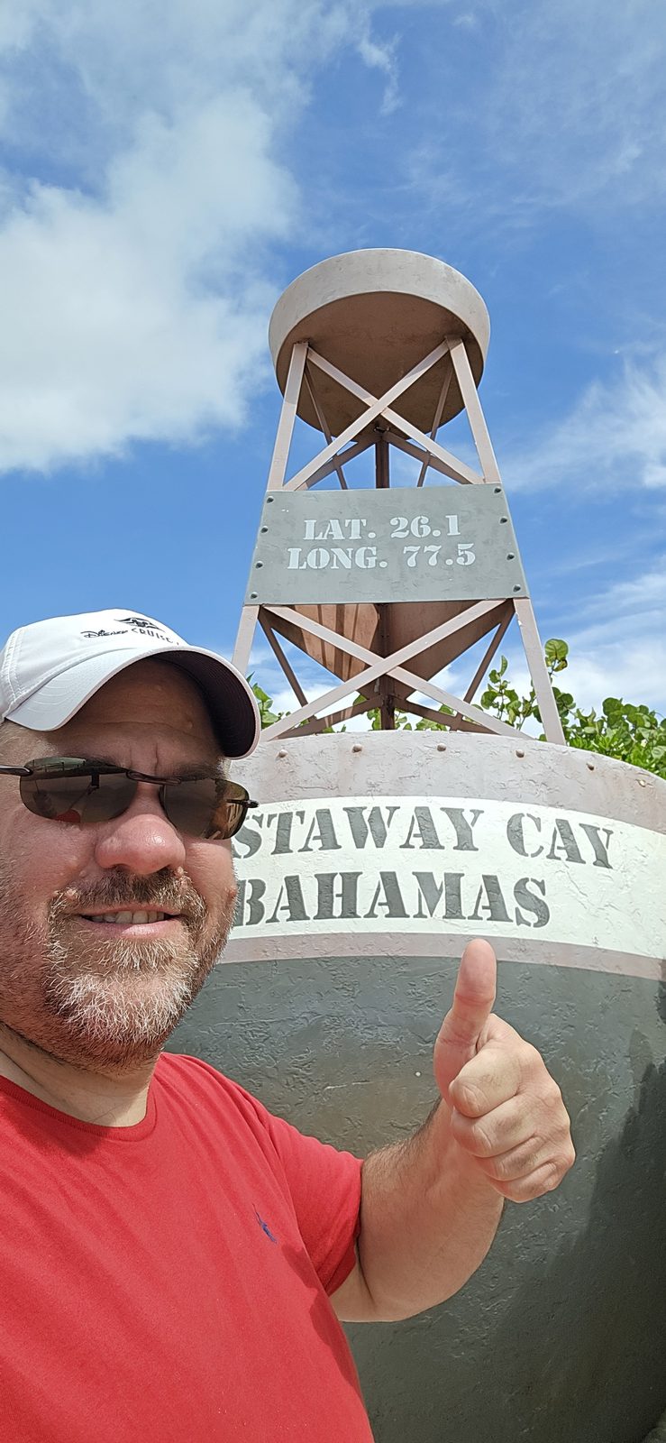 Thumbs up at the water tower sign