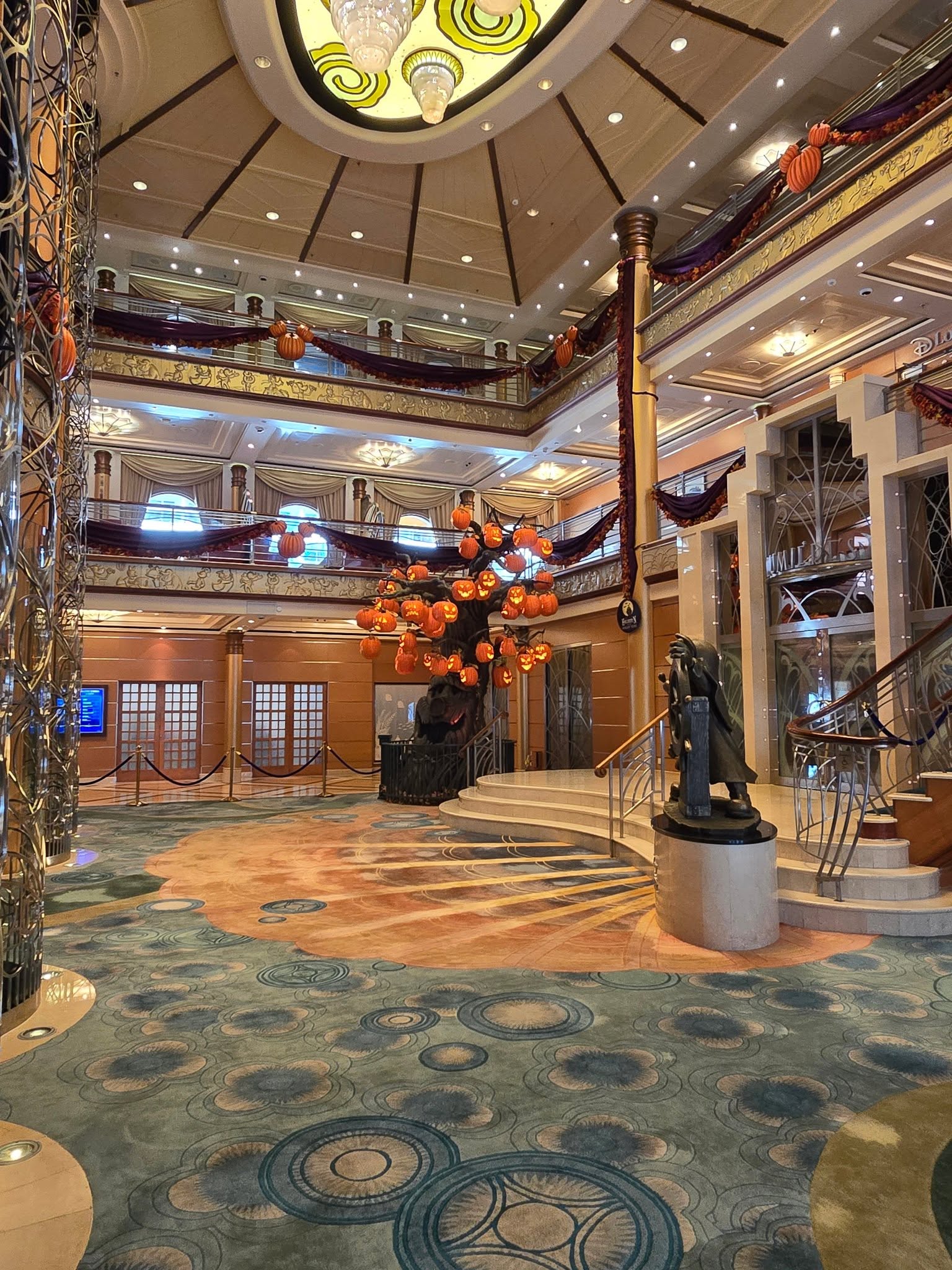 The Lobby Atrium decorated for Halloween on the High Seas, Reap the Pumpkin Tree at the back