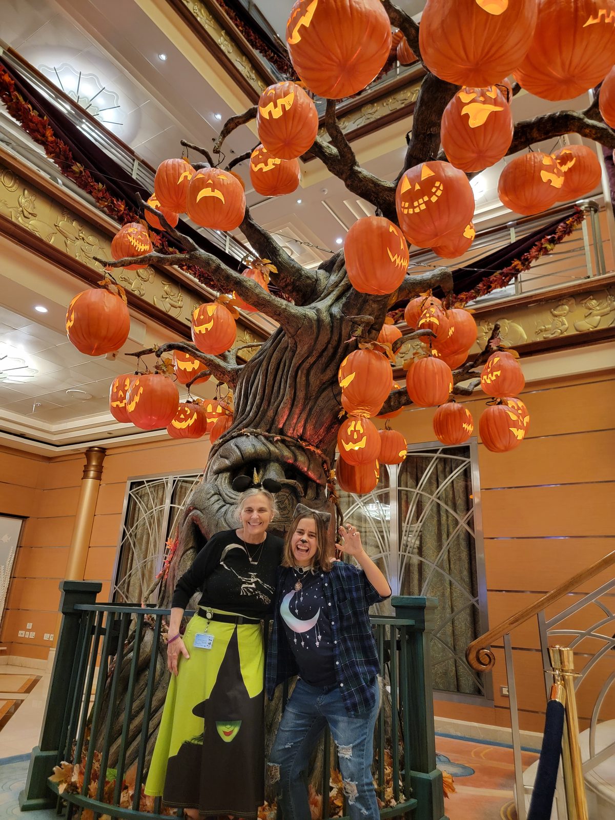 LeAnn and Lisa under the atrium pumpkin tree