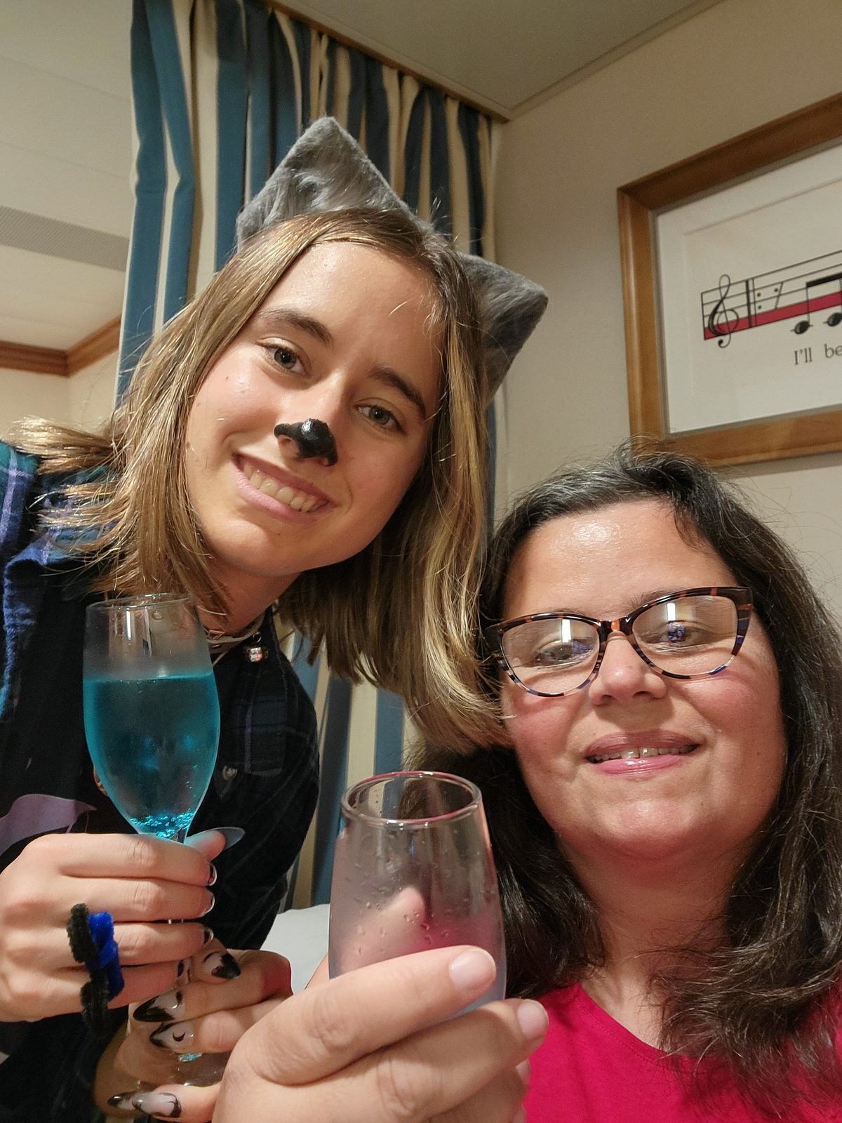 Kathy and Lisa toast with blue mocktails