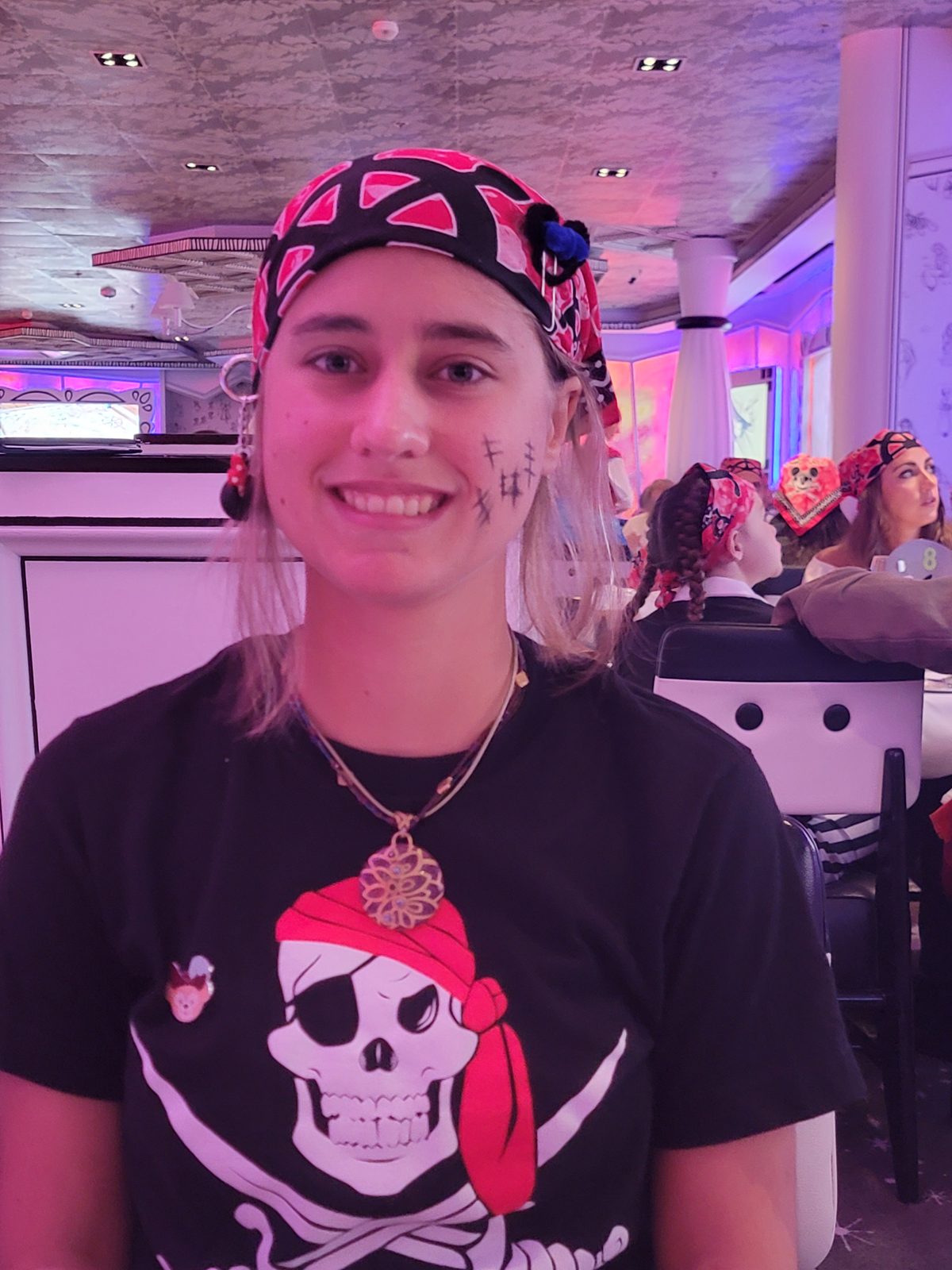 Lisa ready for pirate night with face paint and a bandana
