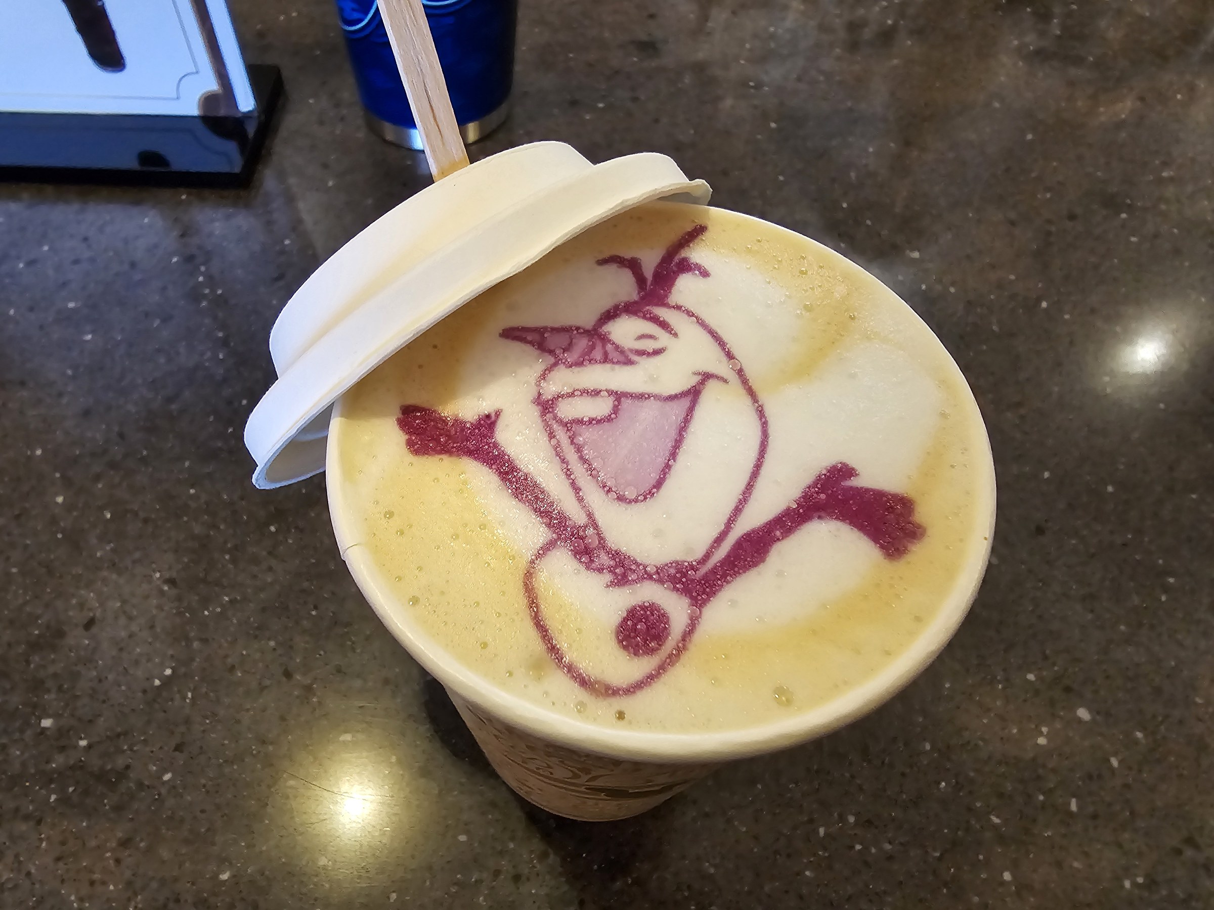 Olaf in the foam of a latte