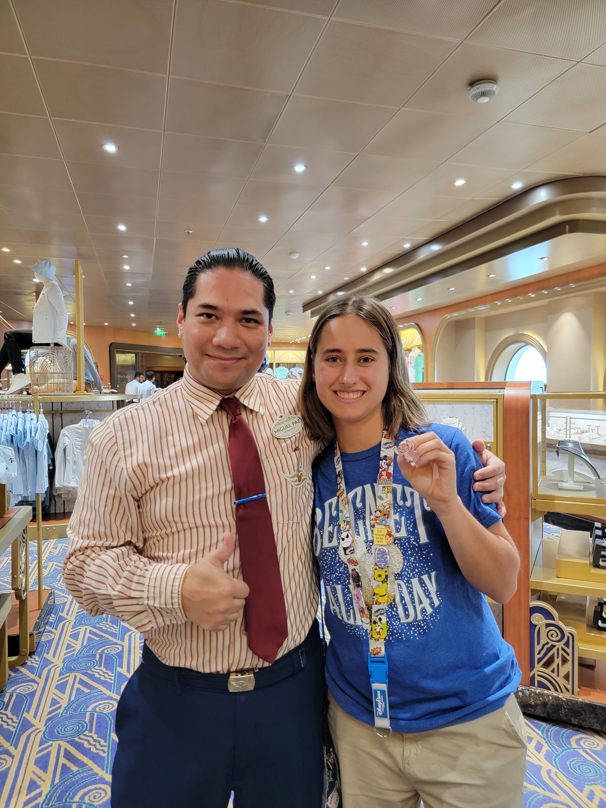 Lisa trades pins with a crew member