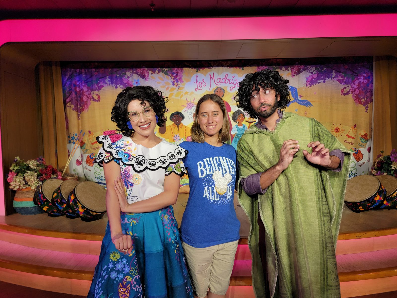Lisa poses with costumed characters
