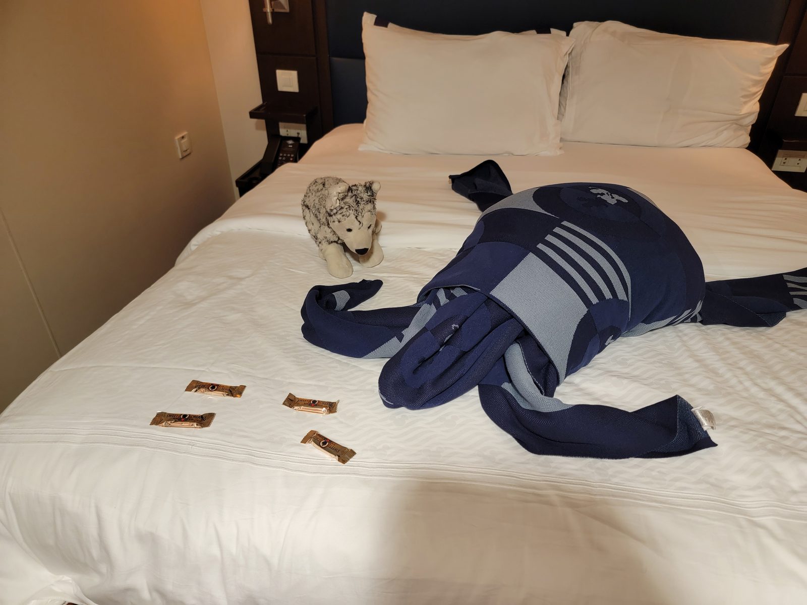 Bob dressed in Lisa's Navy Day gear on the bed