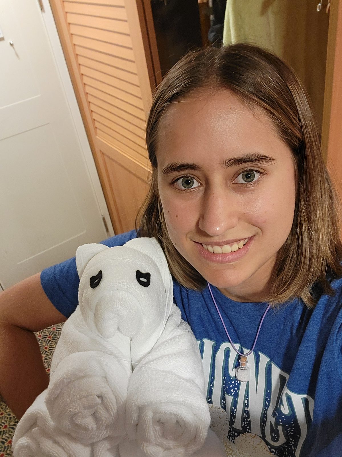 Lisa hugs a towel animal