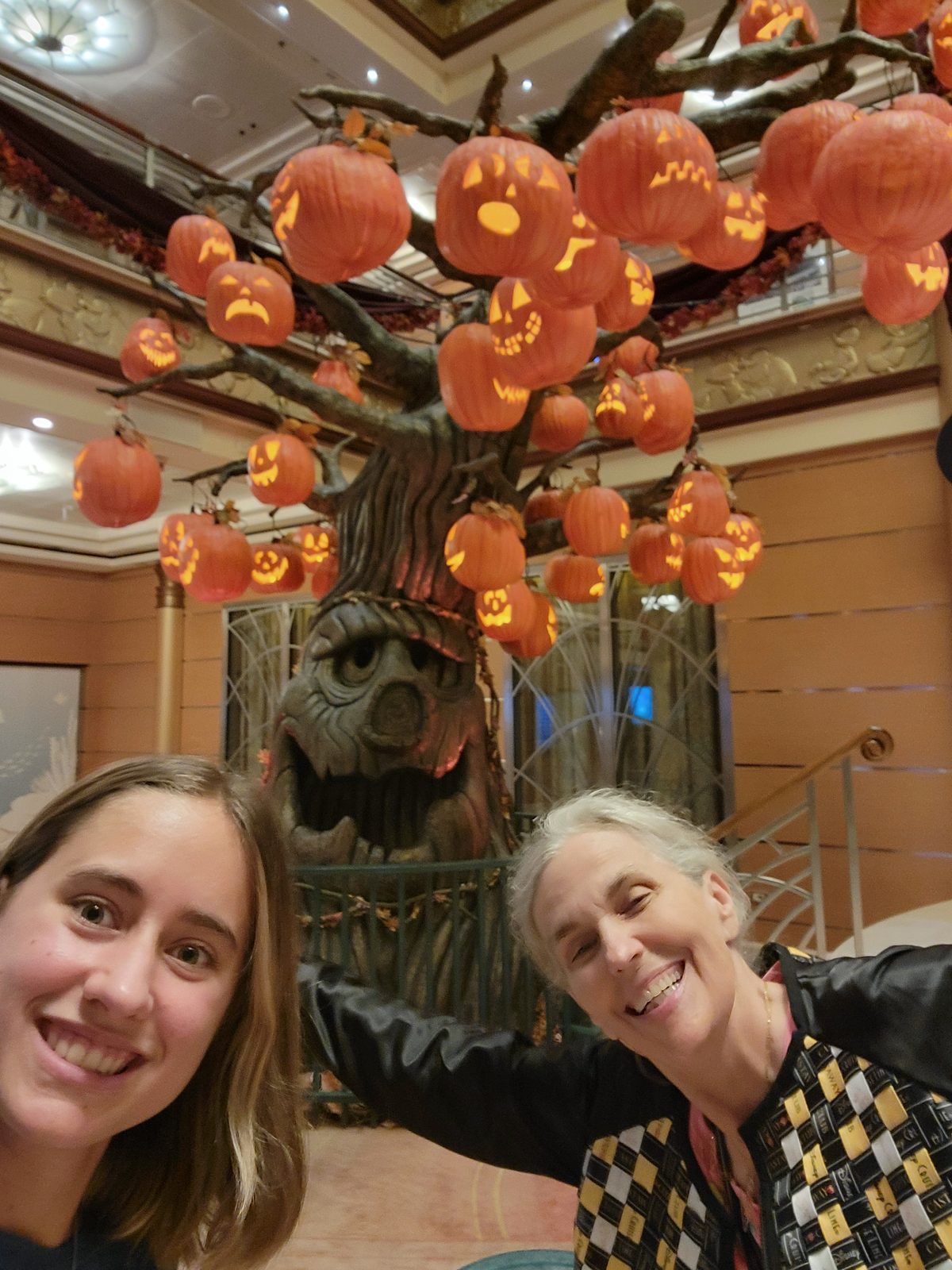 Lisa and LeAnn under the pumpkin tree