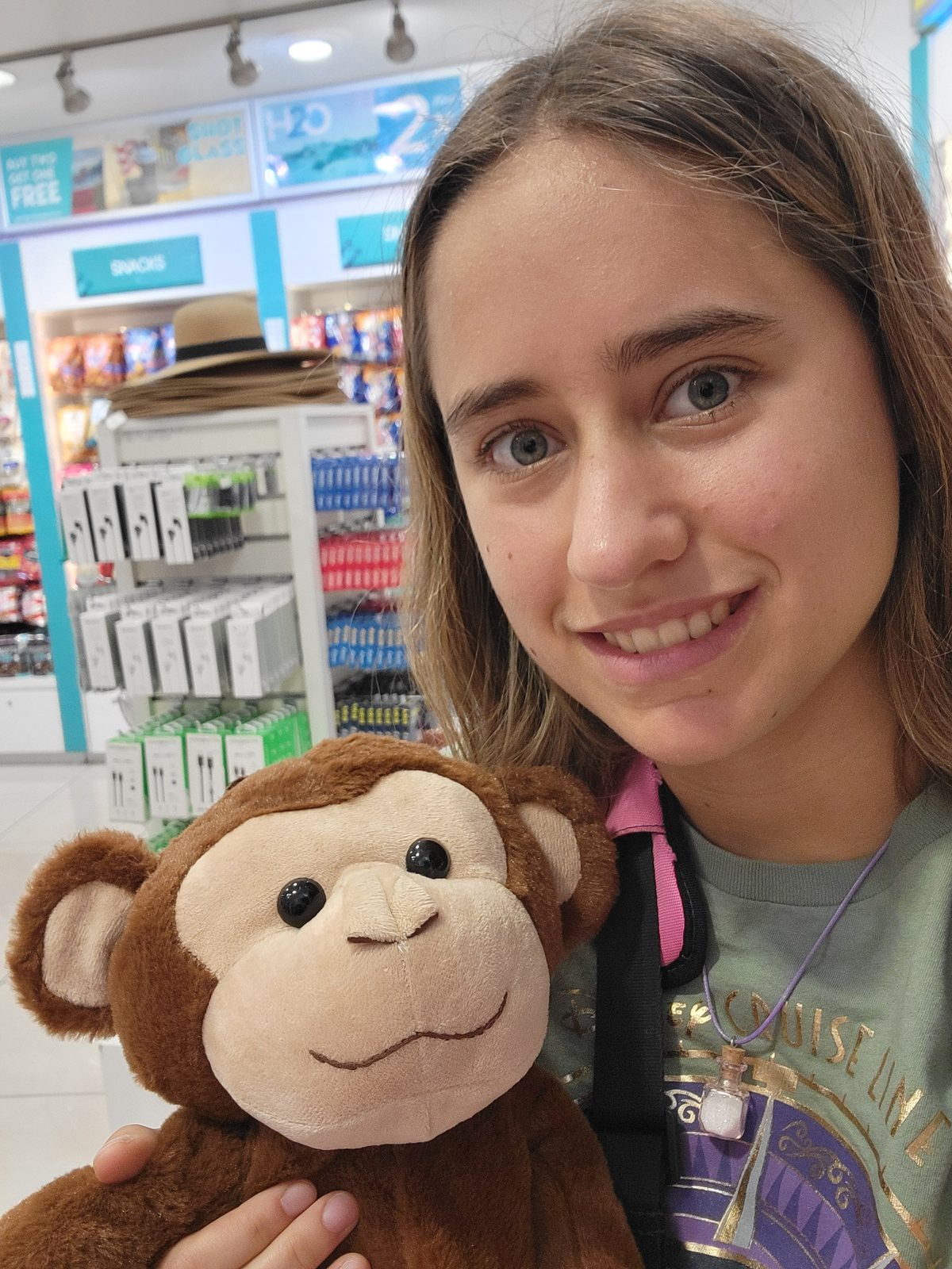 Lisa with a plush monkey in the shop