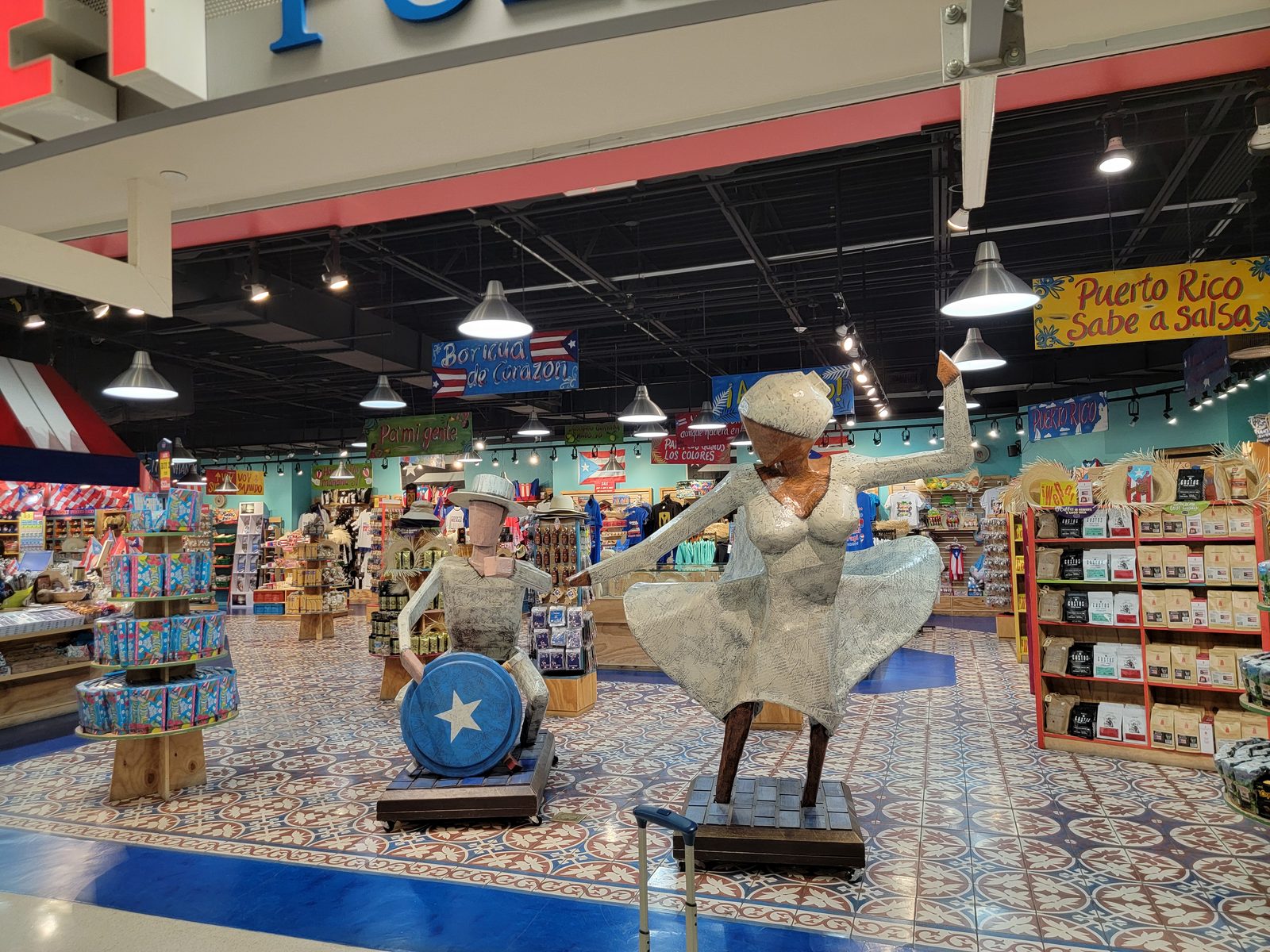 The salsa dancer statues at El Market, in the San Juan airport