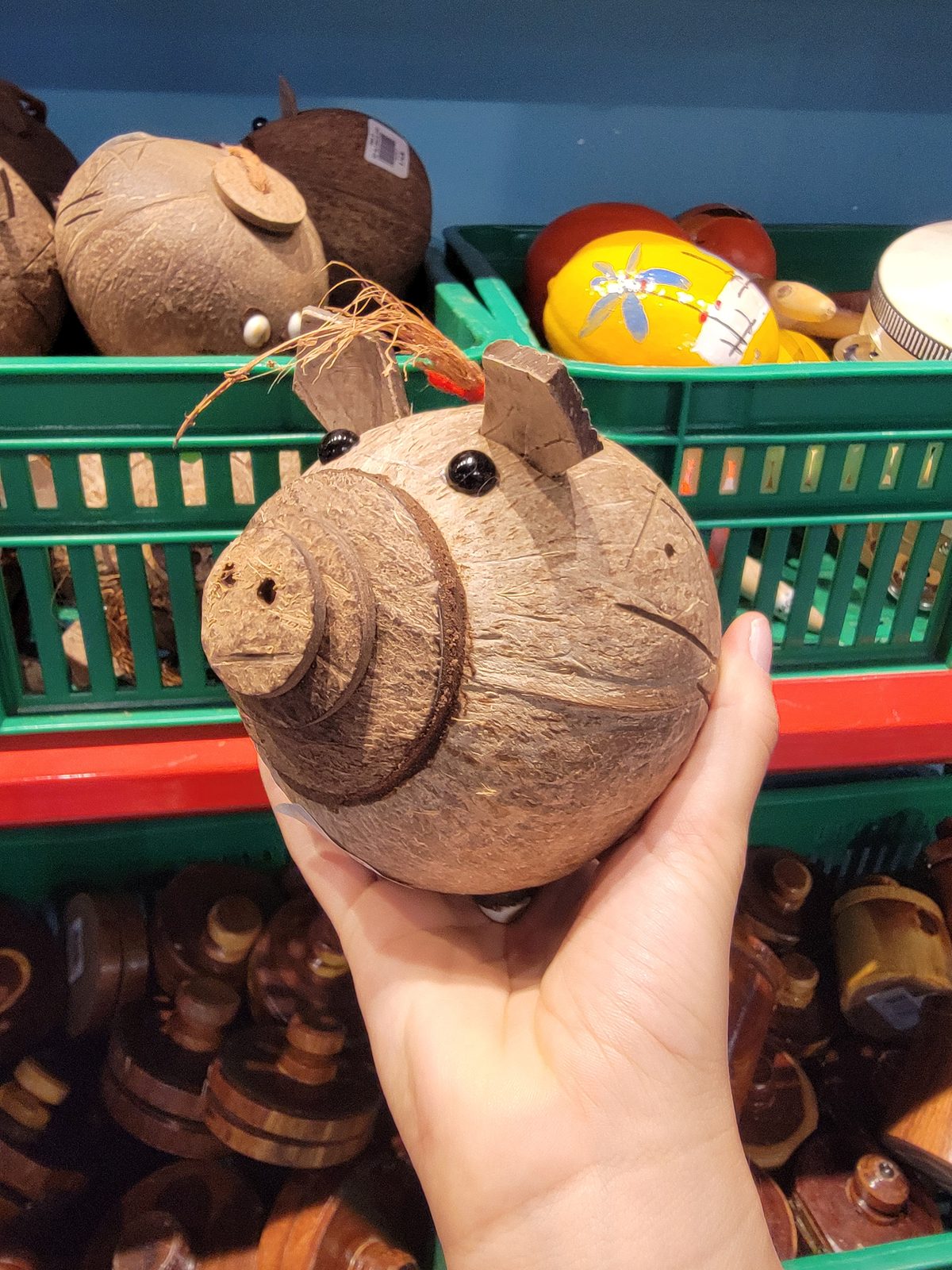A coconut carved into a pig at El Market, in the San Juan airport