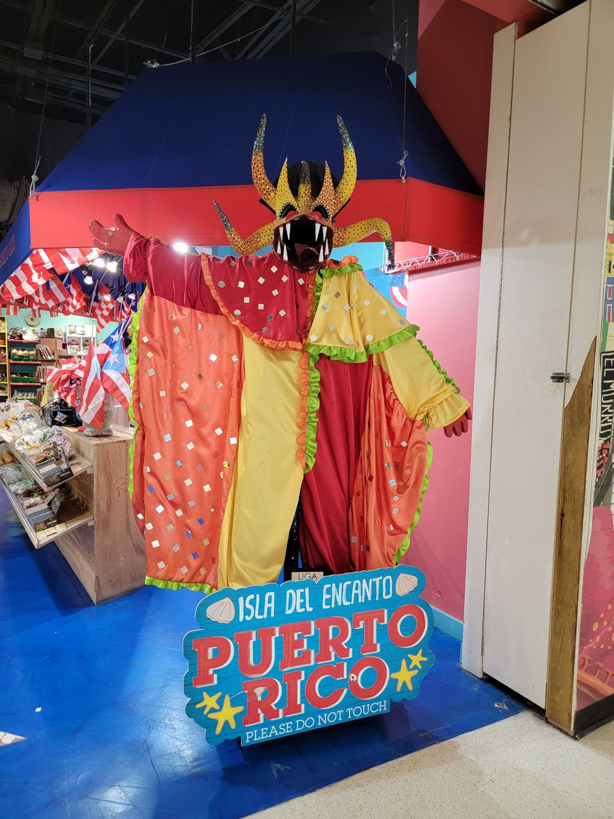 The Isla del Encanto display, a vejigante costume, at the San Juan airport