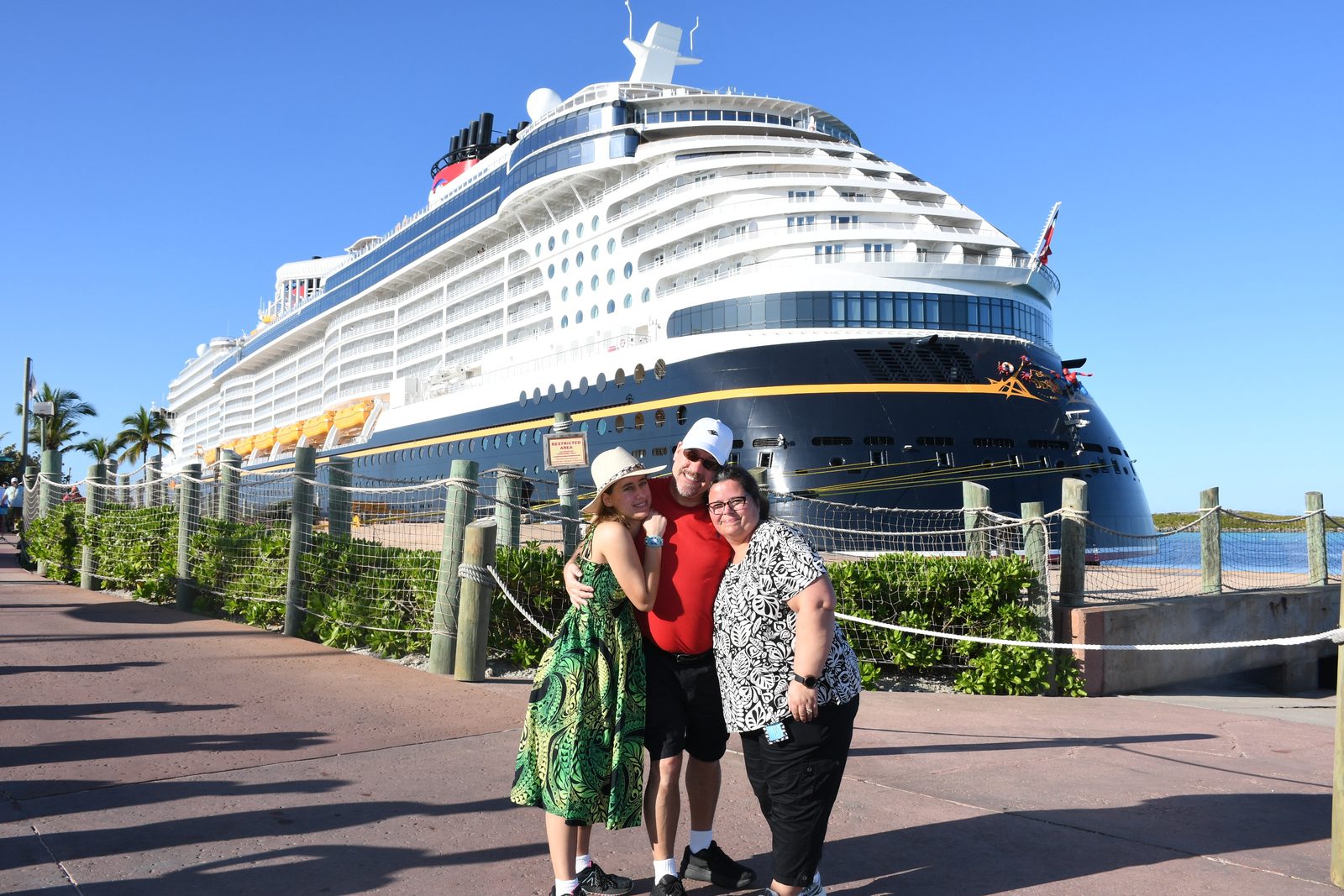 Kathy and family by the Destiny at Castaway Cay