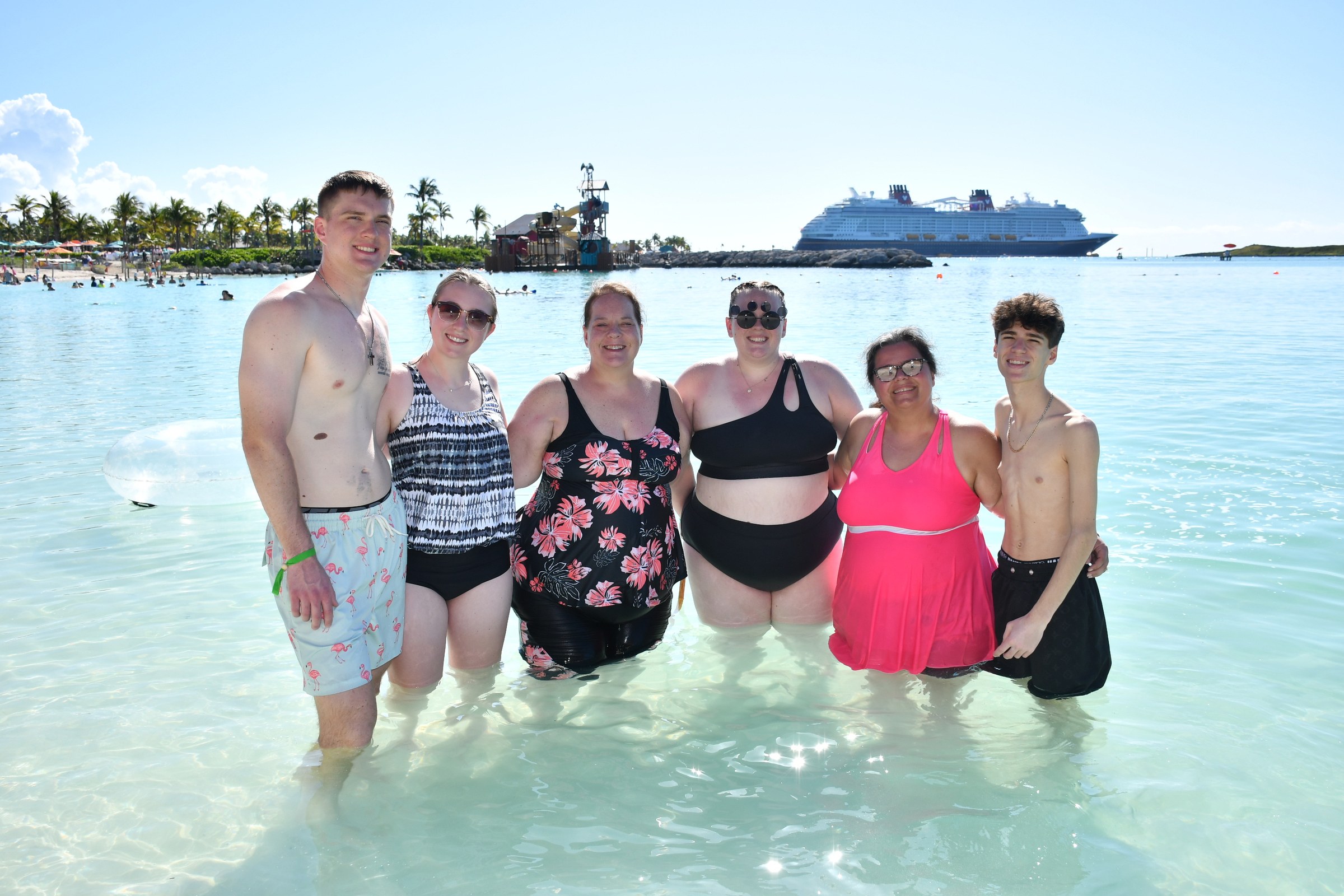 Nathan, Kathy and Thomas with friends in the shallows at Castaway Cay