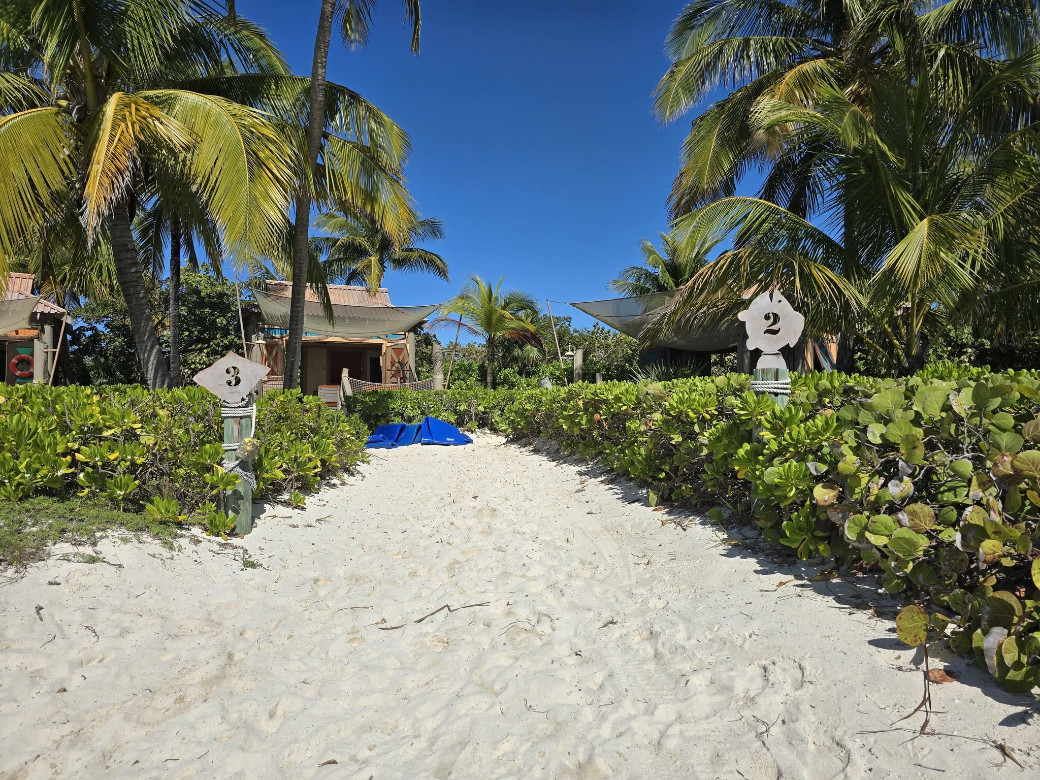 The sandy path past the cabanas at Castaway Cay
