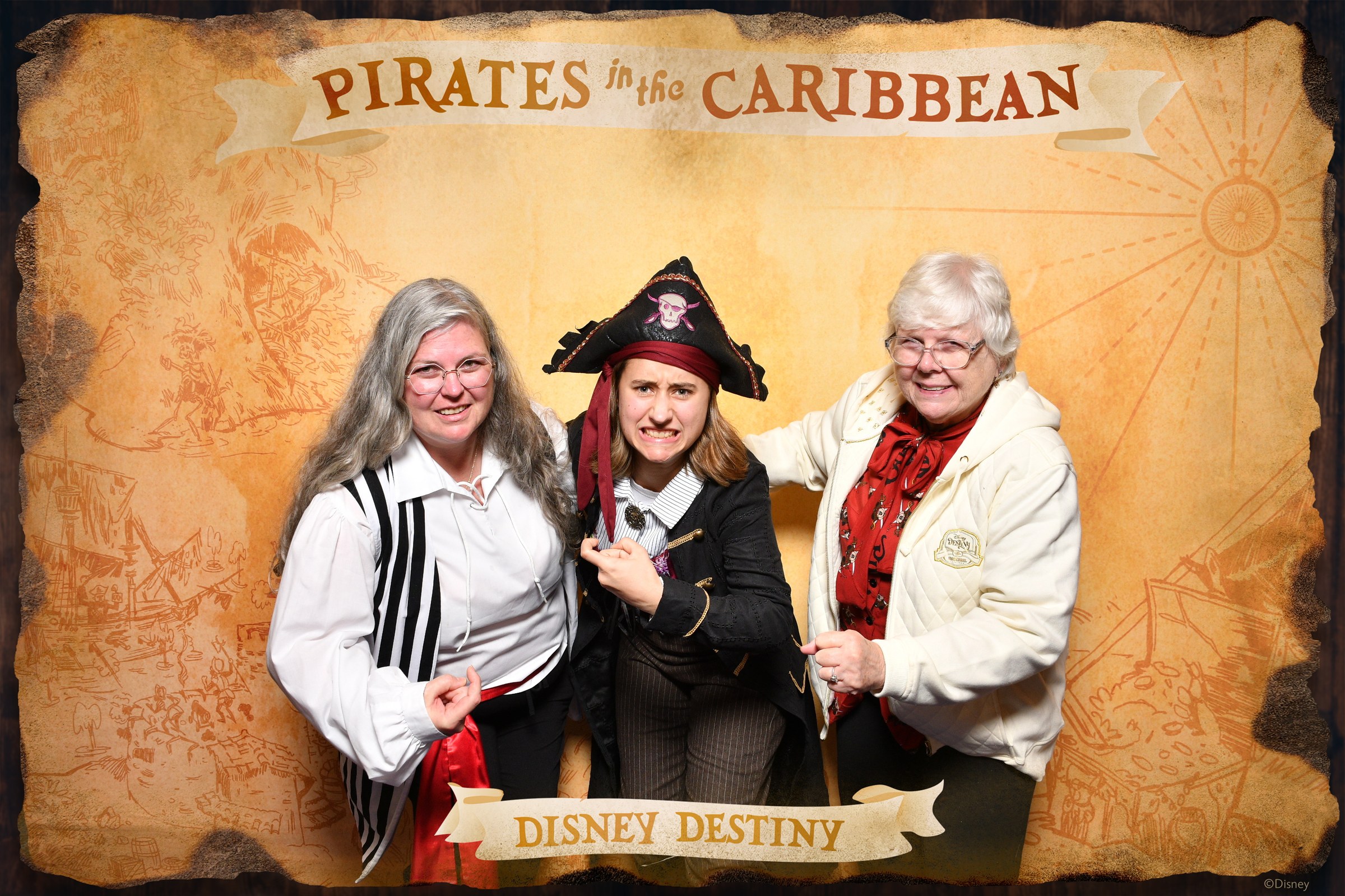 Julie, Lisa and Donna at the Pirates in the Caribbean backdrop on Pirate Night