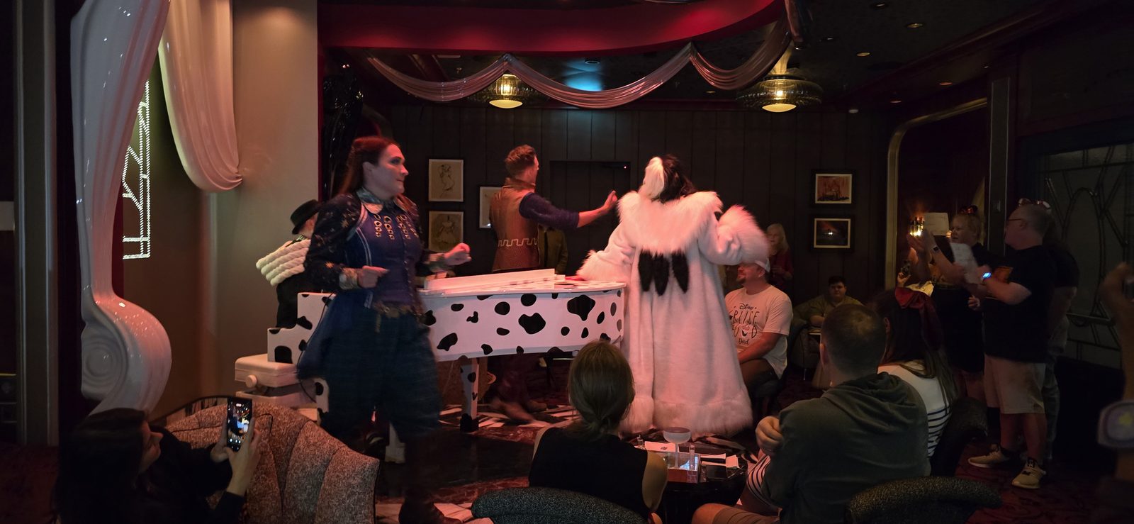Cruella and a dalmatian performer at dinner