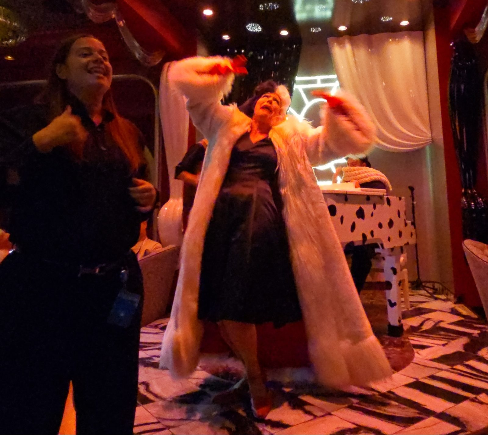 A costumed Cruella performs at dinner