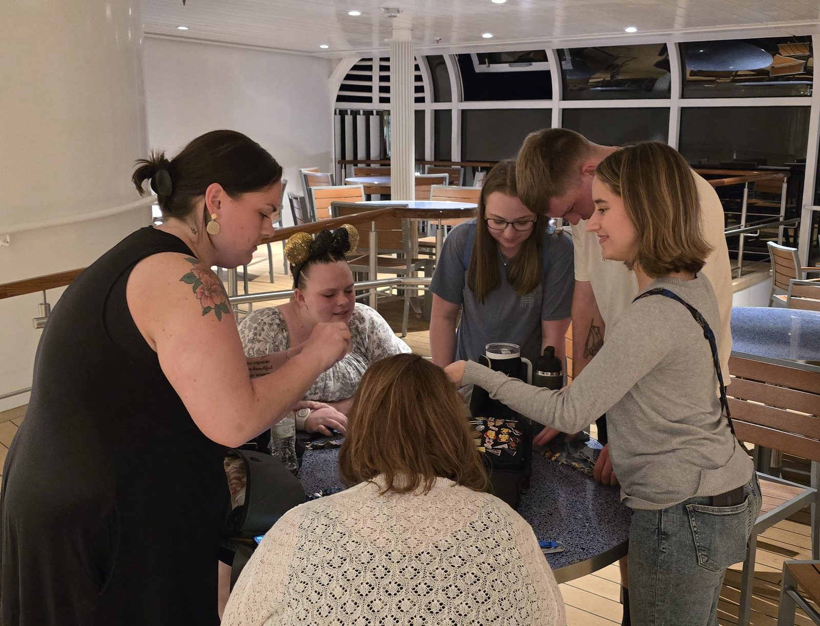 Kersten, Hannah and Lisa around a table on the Destiny