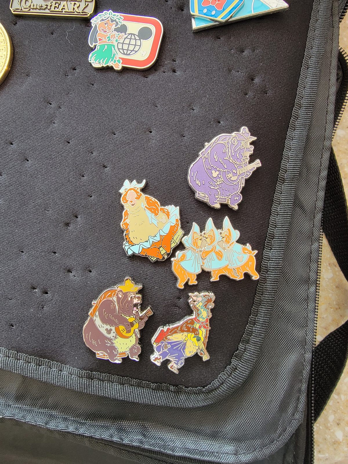Character pins laid out for trading