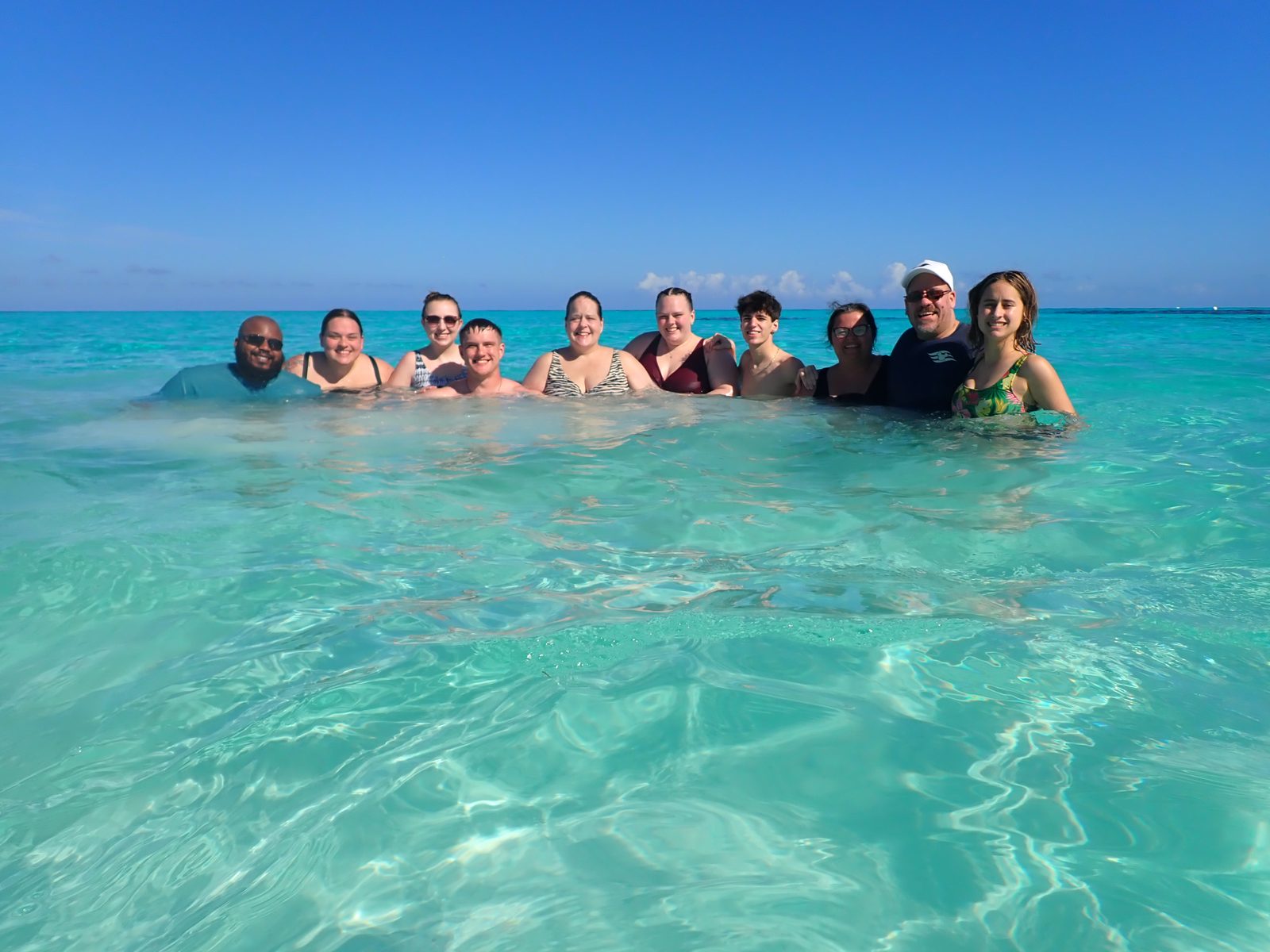 The group swims in turquoise water