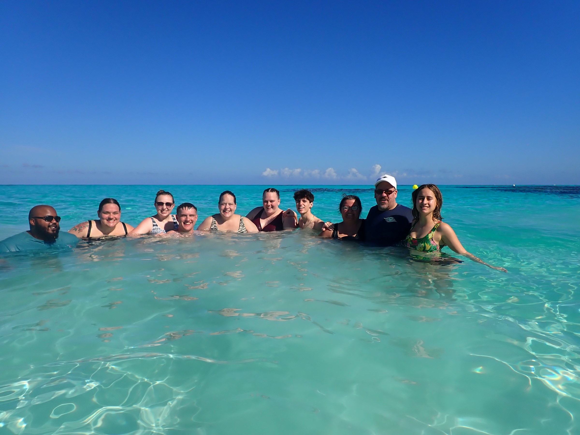 Brian, Kersten, Mackenzie, Nathan, Krissy, Hannah, Thomas, Kathy, Michael and Lisa in the water at Castaway Cay