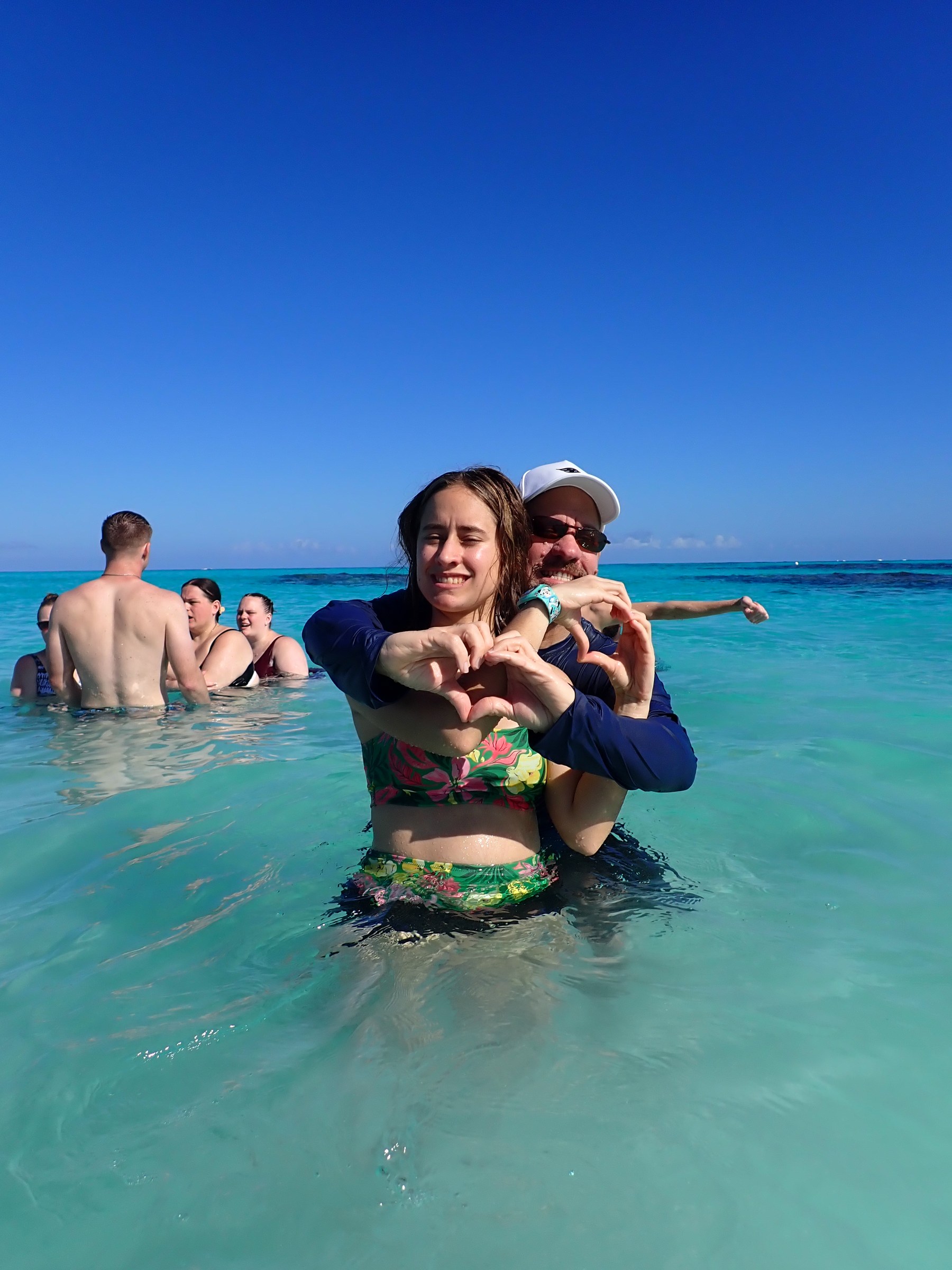 Lisa and Michael making a heart at Castaway Cay