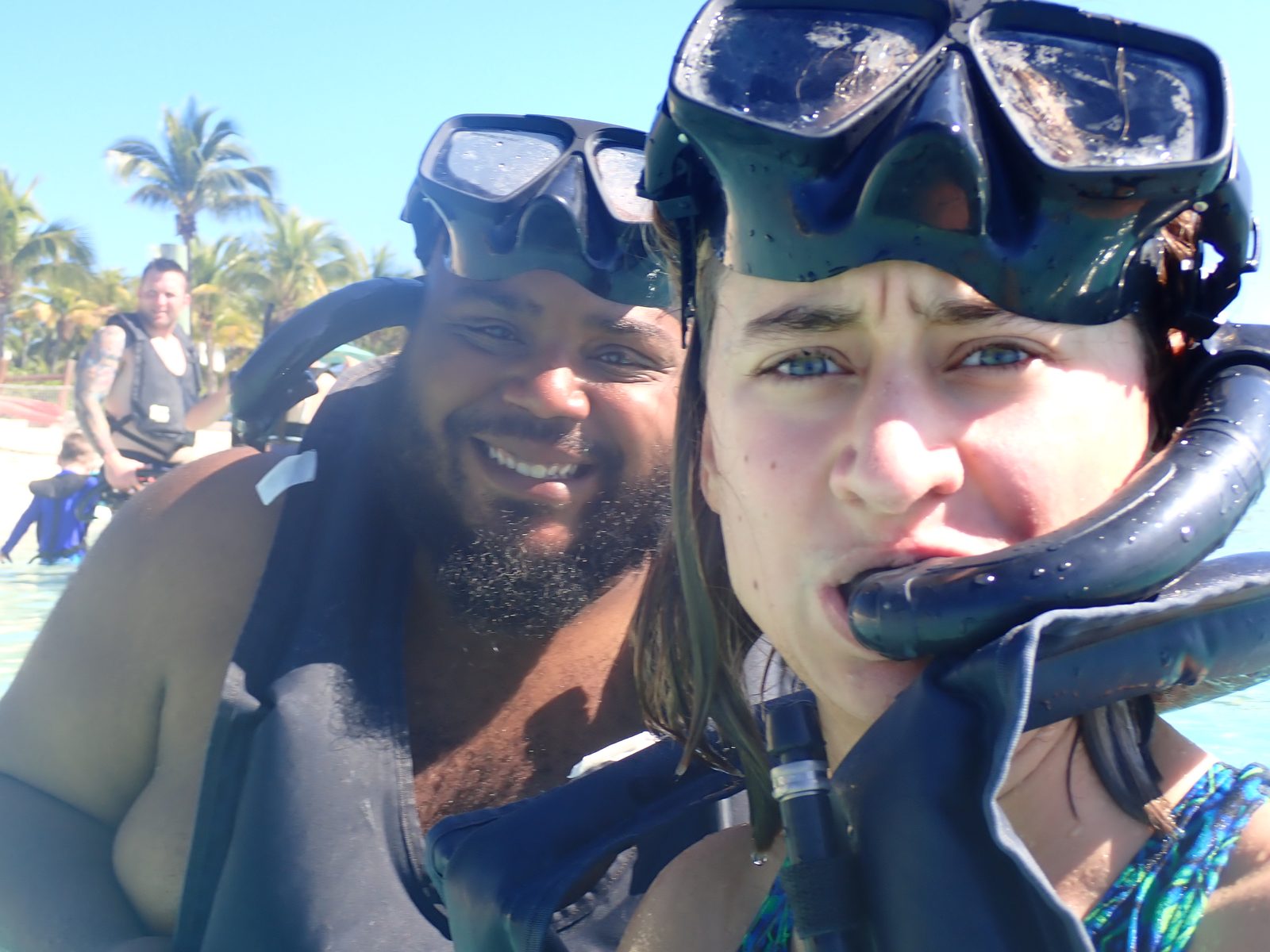 Snorkeling partners surface with big smiles