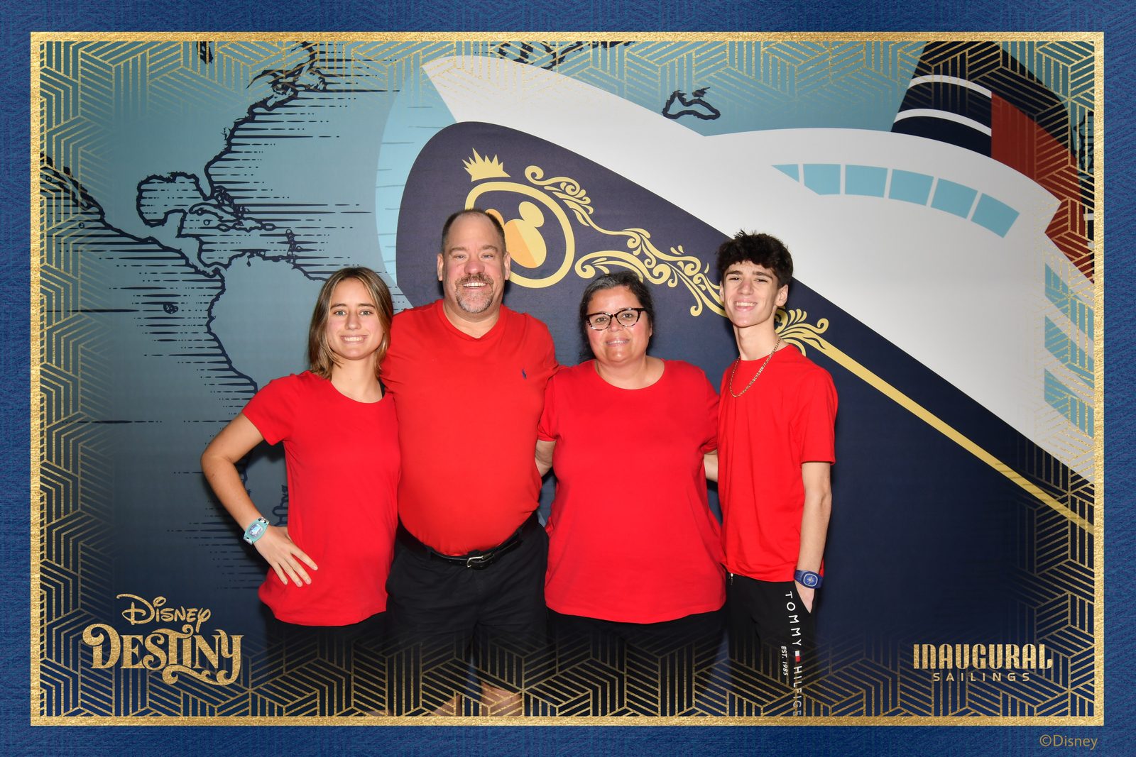 All four at the welcome aboard backdrop