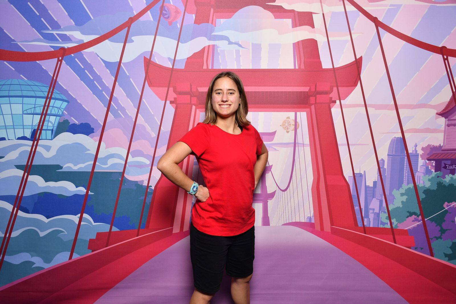 Lisa poses at the Big Hero 6 backdrop