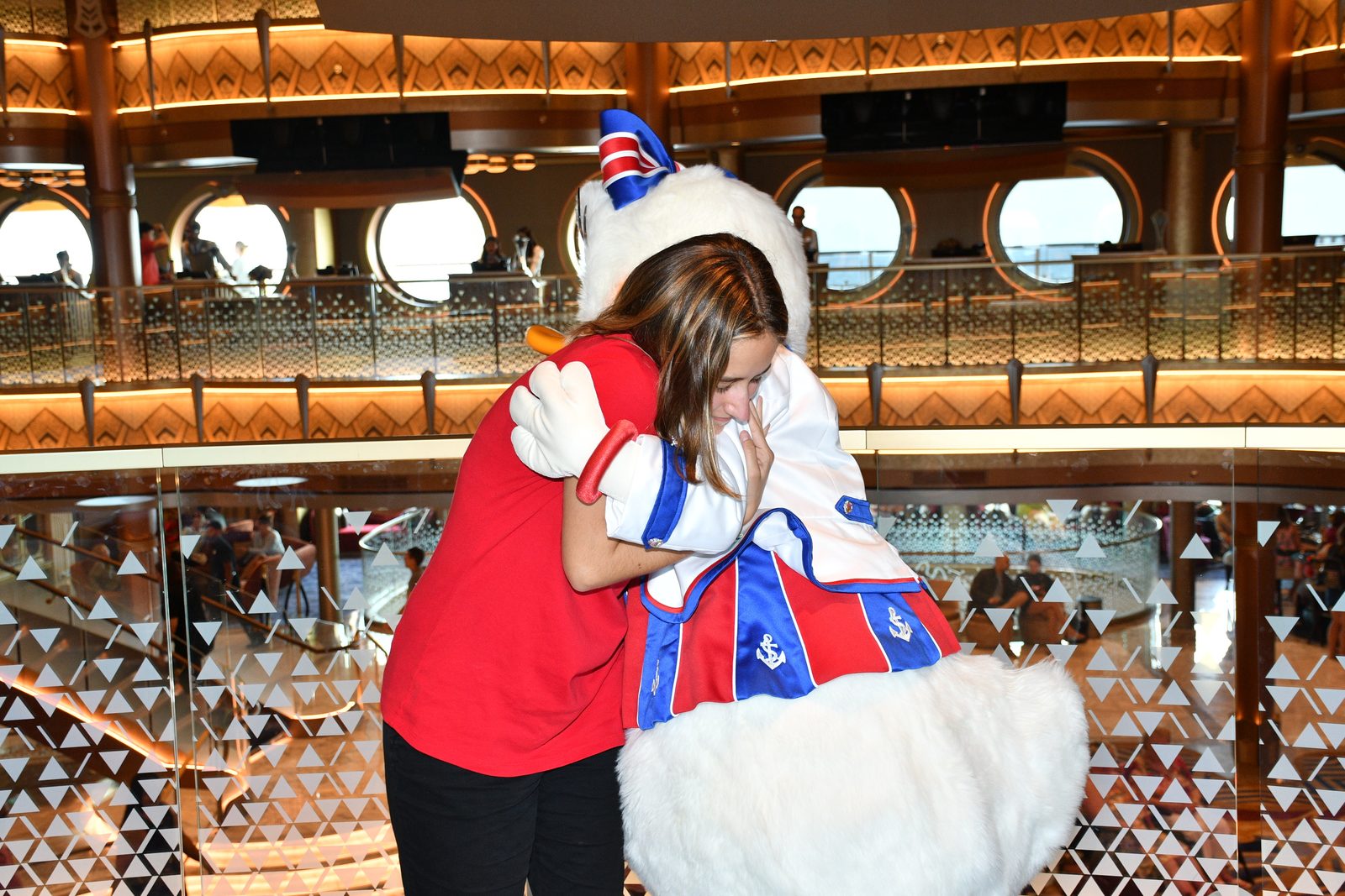Lisa hugs Daisy Duck in her red, white and blue stars outfit
