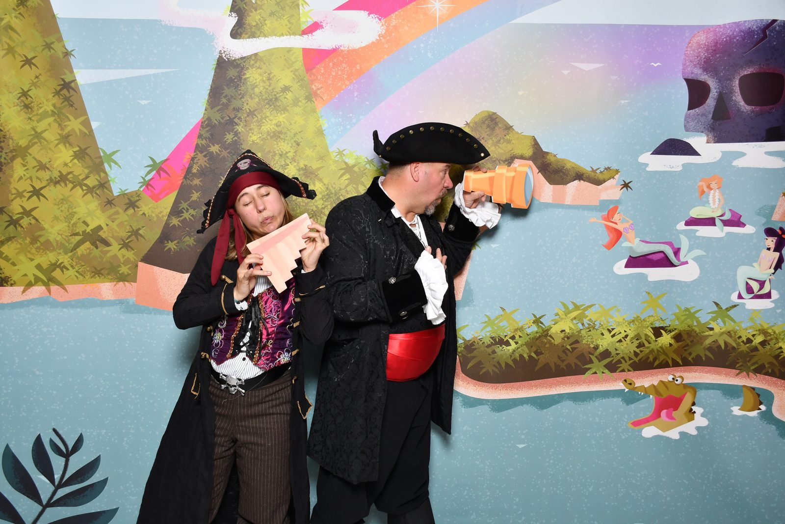 Lisa and Michael at the Neverland backdrop with a treasure map