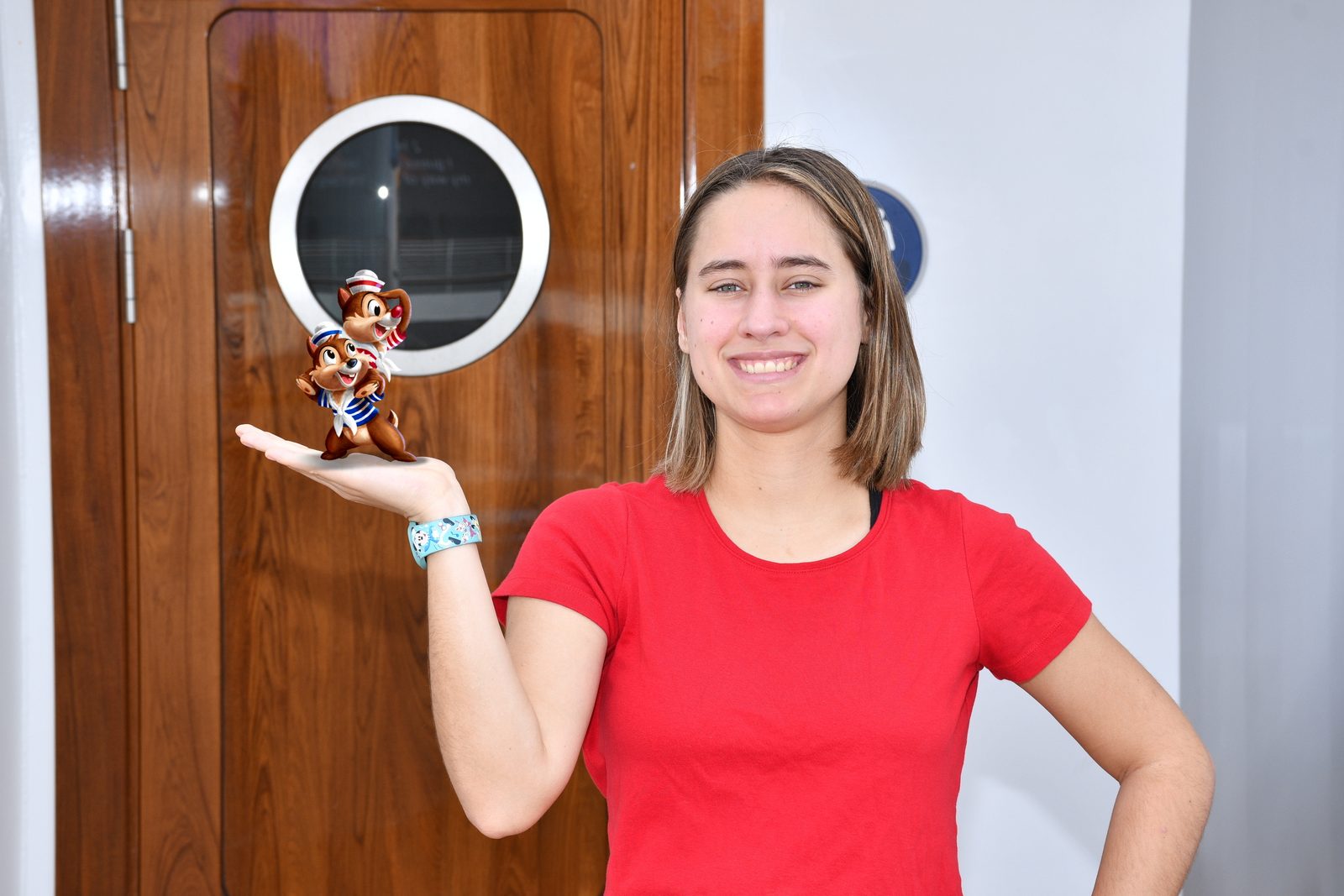 Lisa with a tiny Magic Shot Chip and Dale on deck