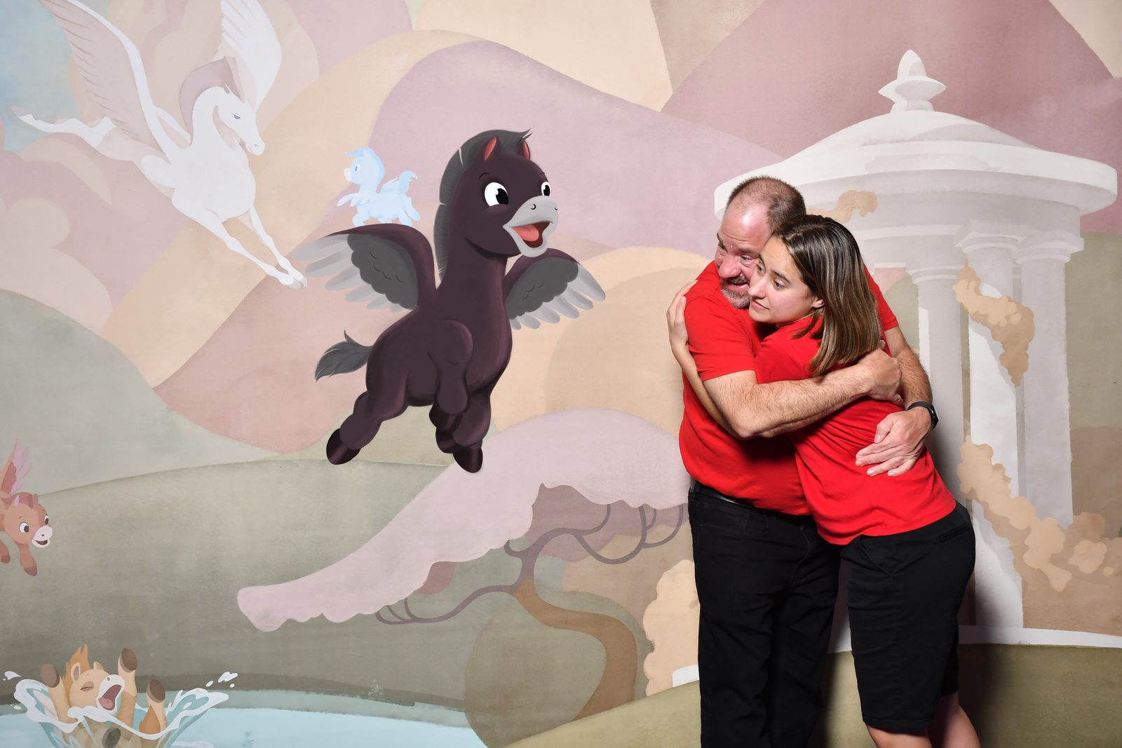 A hug under the Pegasus backdrop