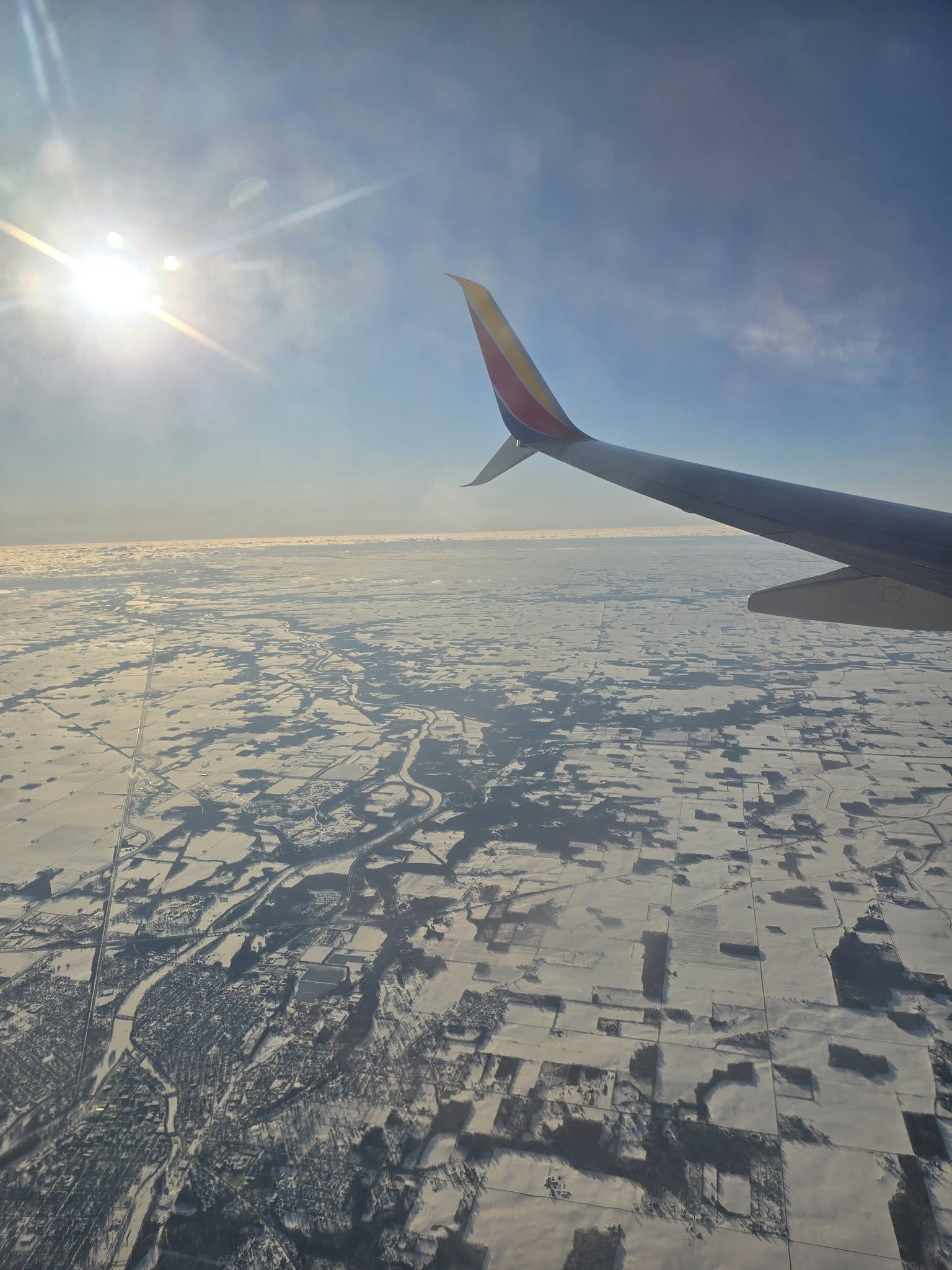 Snow-covered fields from the plane on the way home