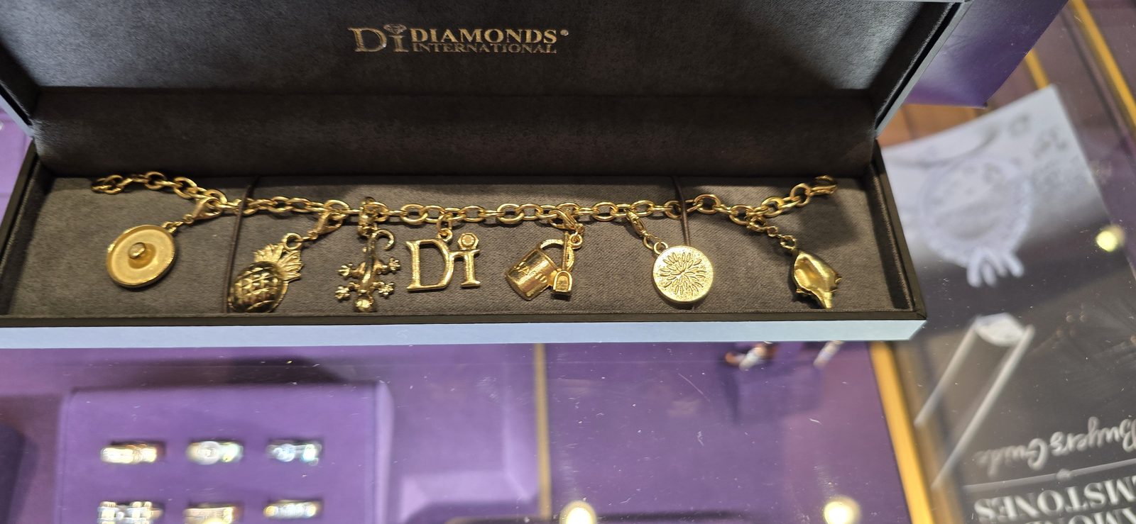 A gold charm bracelet that caught my eye in the ship's shop