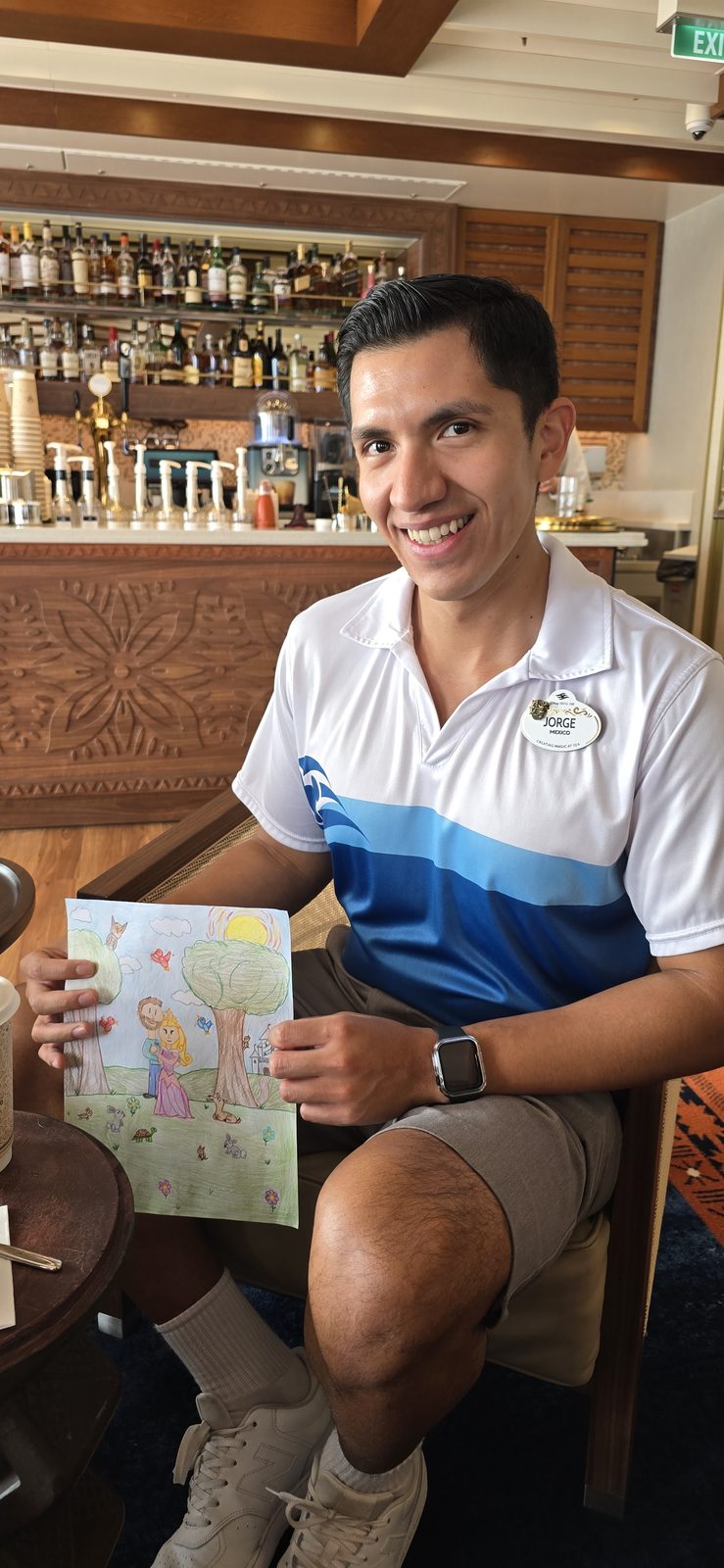 One of the Cast Members with a drawing on the Disney Destiny