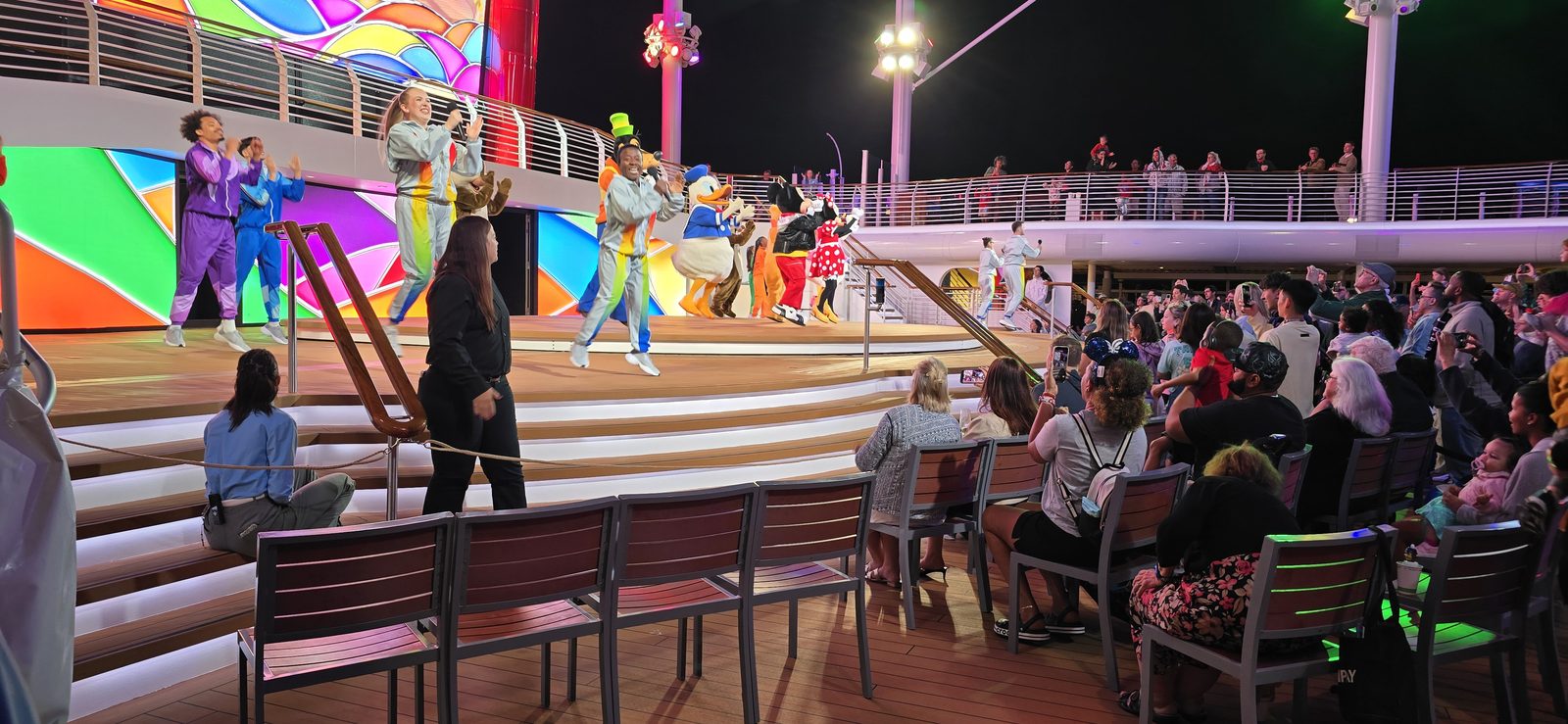 Mickey and friends in their Color Spin outfits at Mickey's Color Spin Dance Party, Melissa interpreting