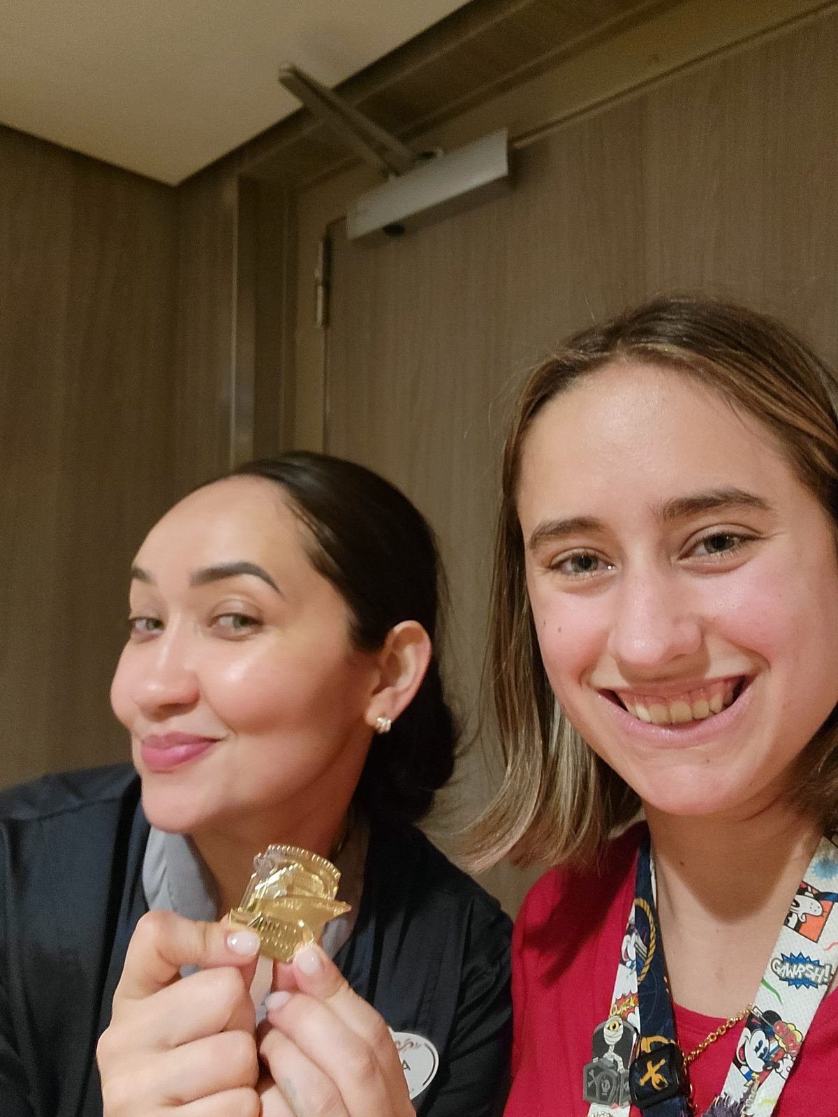 Lisa and a cast member with a gold coin