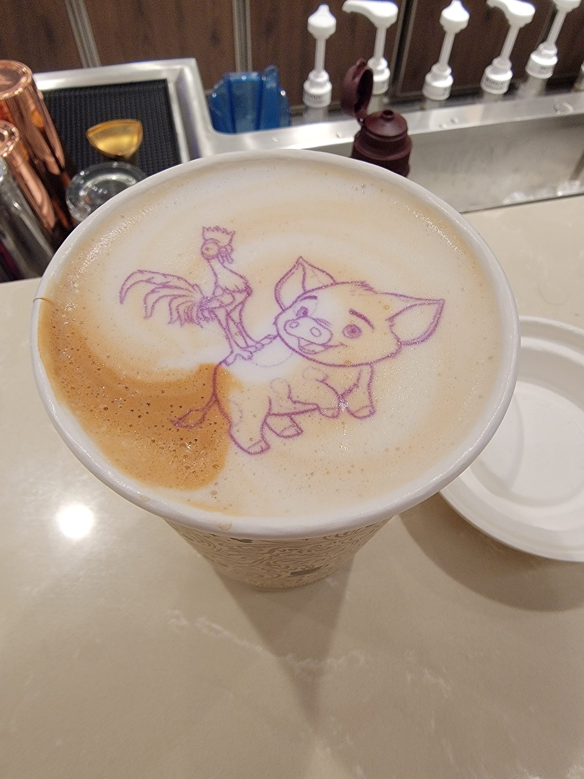 A pig and rooster in latte art while we waited