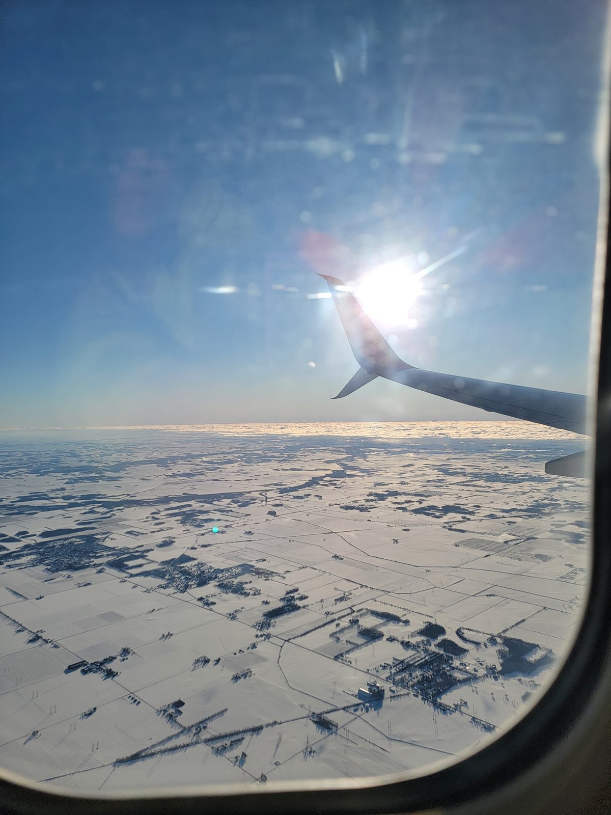 Snow covered fields as we flew home