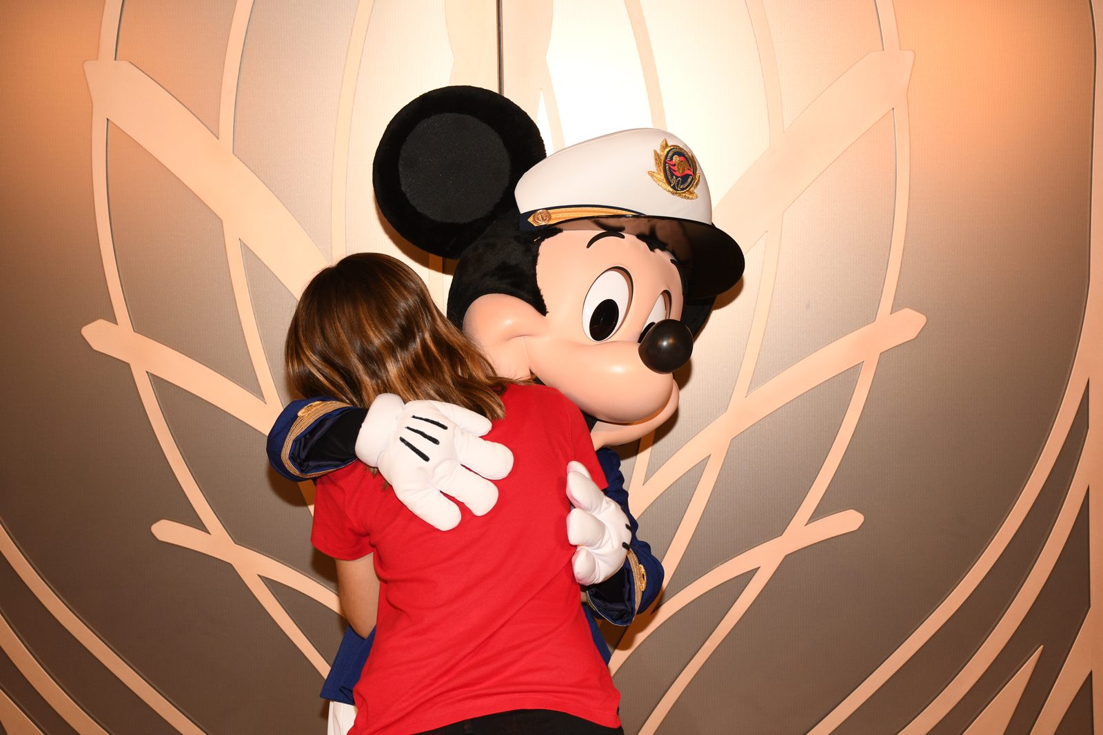 Lisa gets a hug from Captain Mickey