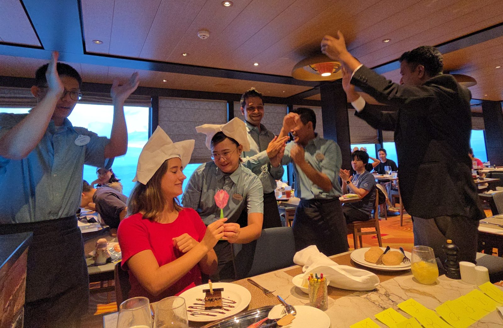 The waiters bring out a birthday cake