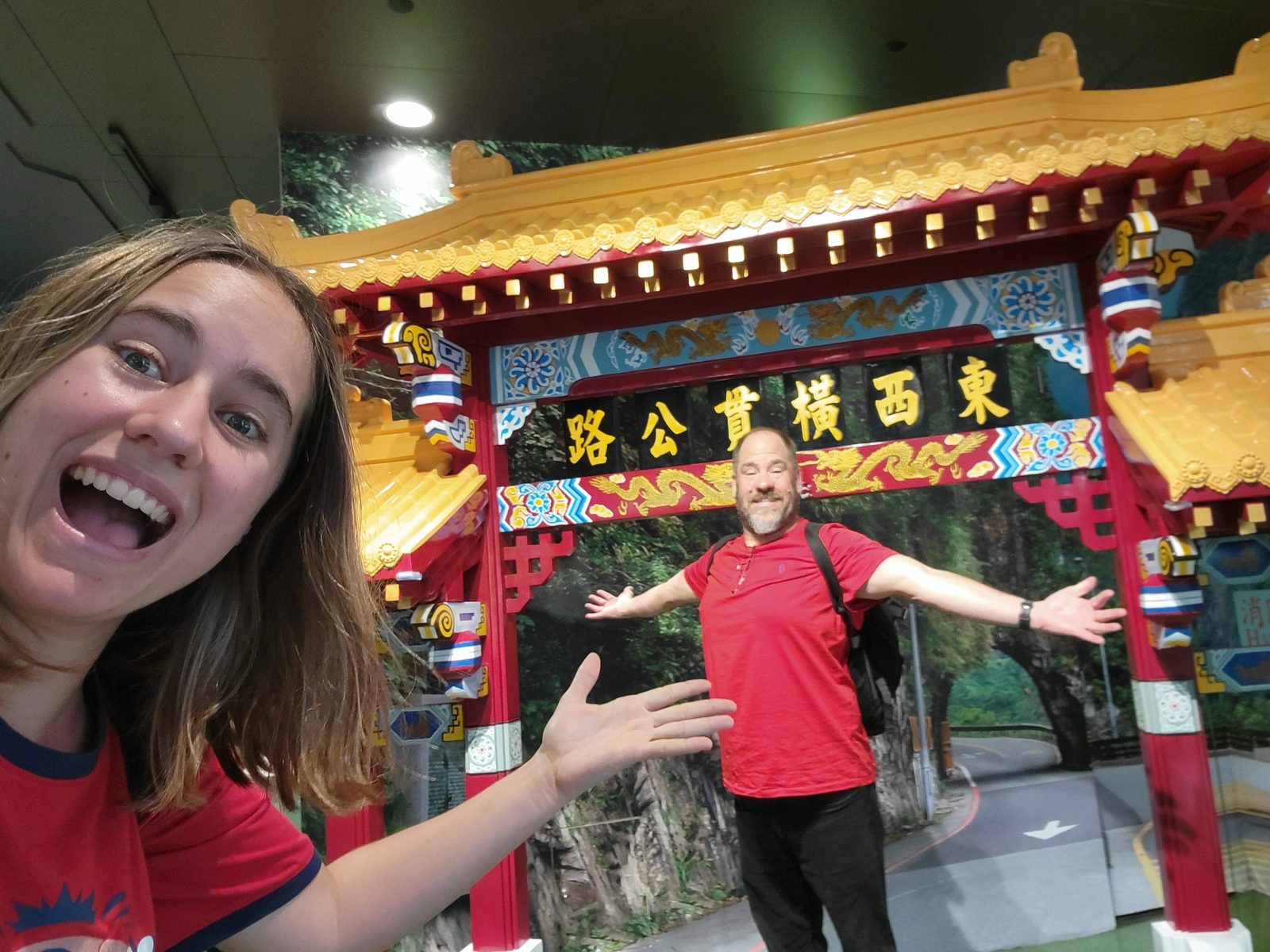 Laughing in front of a Taiwan display