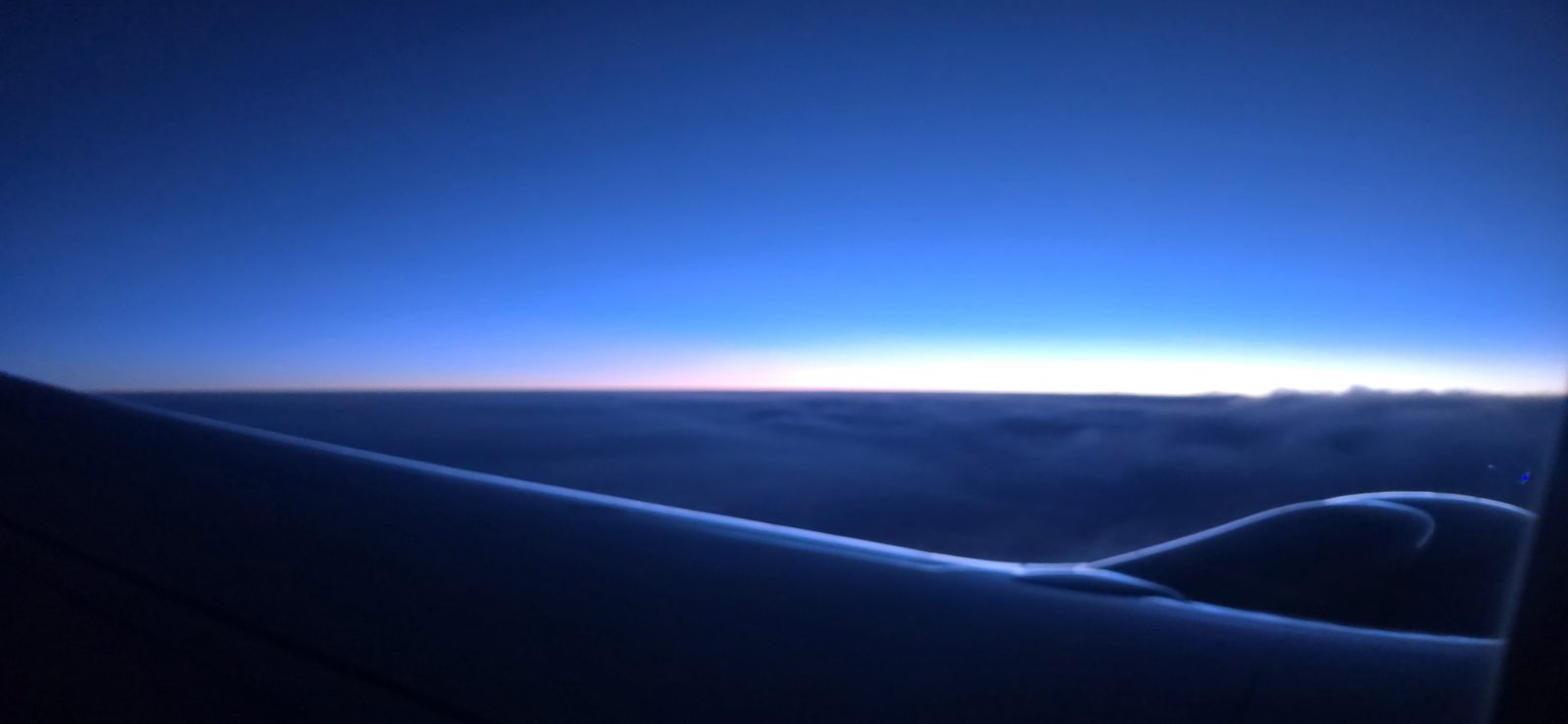 Sunrise over the wing, somewhere over the Midwest