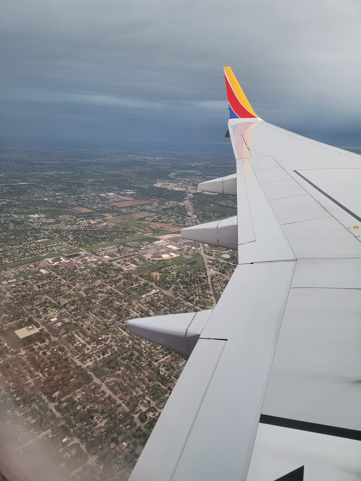 Southwest wing over the suburbs before landing